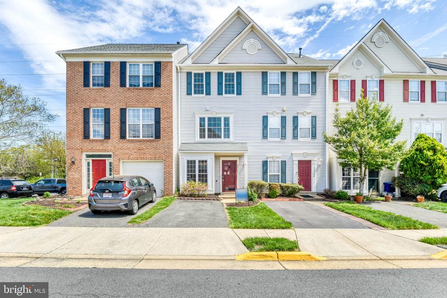 Discover the charm of this beautifully maintained townhouse nestled in the desirable Trailside community. With 1,812 sq. ft. of thoughtfully designed living space, this home offers a perfect blend of comfort and style. The inviting open floor plan seamlessly connects the living and dining areas, enhanced by warm wood floors and recessed lighting, creating an ideal setting for gatherings. The heart of the home is the spacious eat-in kitchen, featuring upgraded granite countertops, a convenient island, and stainless steel appliances, including a gas range and built-in microwave. Enjoy cozy evenings by the gas fireplace, complete with elegant glass doors and a classic mantel, perfect for creating a warm ambiance. Retreat to the serene primary suite, complemented by two additional bedrooms, providing ample space for relaxation or a home office. The two full bathrooms are designed for convenience, featuring a tub shower combination and modern fixtures. Step outside to your private deck and patio, overlooking a tranquil open common area and lush trees, offering a peaceful escape. With a low-maintenance lot size of just 0.03 acres, you can enjoy outdoor living without the hassle. Additional features include upper-floor laundry, assigned parking, and a paved driveway. Recent upgrades include all new windows (2023), kitchen and dining room light fixtures replaced (2022), both bathrooms updated including a new tub/shower in Upper 2 bathroom (2025), and the front trim and shutters painted (2023). This home is not just a place to live; it's a sanctuary where memories are made. Experience the perfect blend of comfort, style, and convenience in this delightful townhouse with quick access to Route 7, the Dulles Toll Road, and Route 28.
