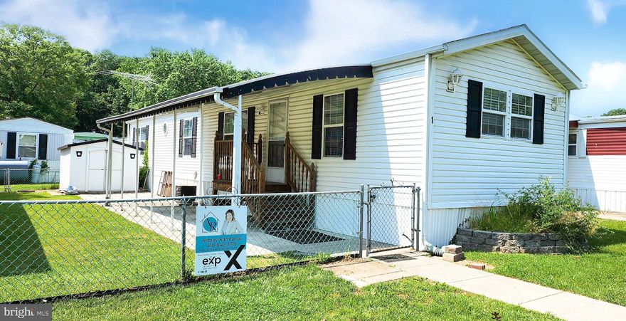 SPACE, CHARM & CONVENIENCE... What a lovely place to call home in the quiet and peaceful community of Ken Lee Park. This home has been well maintained and is perfectly ready for your personal touch.  Updated with stainless steel appliances, a contemporary bathroom and wood style flooring, this property has it all for a phenomenal price. Plenty of natural light throughout the home makes each room feel spacious and inviting. Windows feature custom blinds and both bedrooms have large wall to wall closets. A sizeable covered patio is ideal for outdoor seating, morning coffee and relaxing. Unique to this home is a fenced yard full of plush grass and a convenient shed for additional storage..** LOW GROUND RENT compared to all other mobile home parks in the area** To top it all off, 1 Judywood Ln is conveniently located to shopping and public transportation and is just minutes from White Marsh, restaurants, 695 and other local hot spots.