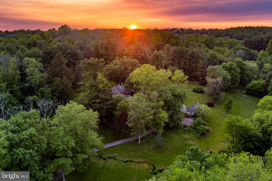 Welcome home to 1329 Sycamore Mills Road – an astonishingly beautiful and peaceful 21+ acre retreat in Edgmont Township. Situated approximately 10 minutes outside of Media Borough in Rose Tree Media School District, the property is comprised of two distinct tax parcels. One is 8+ acres of land and the other is 12+ acres with a 4 bedroom, 3/2 bathroom historic home and a charming guest cottage, as well as a pole barn carport in the woods for storage.  The grounds encompass meadows, streams, wetlands, woodlands and large lawns – a true delight for anyone who loves the natural outdoors, birders and archers alike!

Entering the property along the private driveway, with the welcoming songs of Towhees and Wrens, you realize that you have arrived somewhere truly special. With incredibly quick and easy access to Media and West Chester Boroughs, Philadelphia International Airport, SEPTA stations, and major highways, it is completely unexpected to find yourself somewhere so quiet, peaceful, private and seemingly remote.  
 
On the right, set far back from the road, is the Guest Cottage. This quaintly appealing building has served as an entertaining space, complete with 1895 tournament billiard table, as well as a respite to family members over the years. This approximately 1000 SF single story bungalow has a flexible open plan, a small kitchen/bar, a fireplace, separate HVAC system and a full bathroom. Off the back, the double sets of doors access a deck.

Further along, sitting on a knoll and tucked into the landscape, is the main residence. Originally constructed in 1809,  later historically sympathetic additions significantly expanded the footprint. The timeless architectural details include stone construction, real window shutters, cedar shake roof, covered porches and private patios. Follow the brick footpath to the main entrance of the home. Inside and to your left is the spacious formal living room with a wood burning fireplace and abundant natural light. Off the entryway is a guest powder room. Pass through beautiful French doors into a library with fireplace that could be used as a dining room or home office.  Each end of the house has a staircase to the second floor. Past the first staircase on the left is the intimate dining room and, on your right, a wonderful butler’s pantry leading to the kitchen. The country style kitchen is the true heart of this home with extensive counters and cherry cabinets, room for a large dining table, a seating area, and a phenomenal “walk in” fireplace. The second entry hall leads to the informal entrance to the home, the second staircase and a large walk-in pantry. Behind the kitchen is the family room with built-ins, a hidden access to a partial cellar, and a second powder room.

Head upstairs to the primary suite which houses a loft area that serves as an ideal workspace and the laundry. To the left is the primary bedroom with dual closets – one of which is a large walk-in. The primary bath has dual vanities and leads to a wonderful sunroom with inground hot tub. Just outside is a lovely patio area. The balance of the second story is a full hall bath and two delightful bedrooms. A staircase leads to another bedroom suite complete with walnut floors that were grown on the property, and full bathroom on the third floor.

The property was featured prominently in the 2015 movie, The Benefactor. During filming, the stars Richard Gere, Theo James and Dakota Fanning relaxed in the Guest Cottage between their scenes. Now it is ready for the next owners to realize their own vision, whether continuing to cherish it as it is currently conceived, or possibly subdividing or expanding. A plot plan prepared by a local engineering firm is in the attachments. Private tours only – please do not enter the property without an appointment.