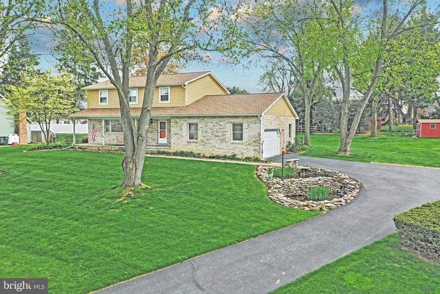 This beautiful 2-story is located in a quiet neighborhood in the heart of Manheim twp. Meticulously maintained and updated throughout. Your guests will love the Koi pond welcoming them at the entrance to the driveway. Entertaining is easy in this open floor plan. The updated kitchen with Corian countertops are open to the dining area and family room with a gas fireplace, and adjacent to the four season room. The second floor features a master suite, large bedrooms and loads of closet space, with a newly remodeled baths. Extra space finished in the lower level with a gas fireplace. Roof and siding only 2 years old, and 2 storage sheds are included. Located close to schools , shopping, and major highways.
