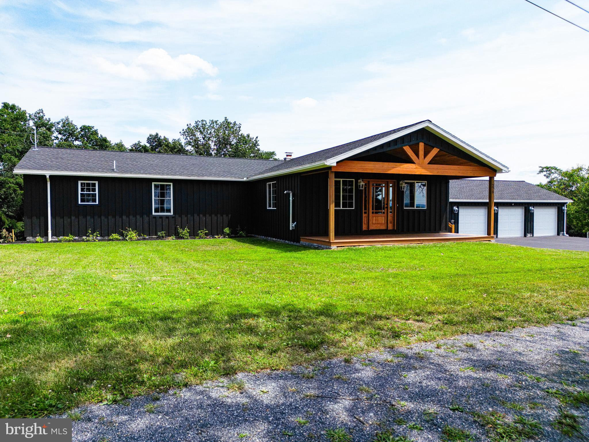 ***OPEN HOUSE SATURDAY 9/6 FROM 1PM TO 3PM***HORSE LOVERS/OUTDOOR ENTHUSIASTS DELIGHT***NEW BUILD***RARE FIND***CLEAN AND GREEN*** 4 Bedrooms, 3 and a half bathrooms, oversized 3 car garage, 11.65 acres, 3 stall horse barn with additional storage, new saline pool. Rustic feel home with all brand new amenities. Inviting 24X8 covered front porch enters into large living room with vaulted white washed knotty pine ceilings, natural hardwood floors and pellet stove. Living room opens into chefs choice eat in kitchen with large island, butcher block counters, custom "soft close" walnut cabinets, stainless steel appliances, and pot filler over the stove. French double doors on the rear of the kitchen lead to 27X14 covered rear deck complete with included table and chairs, 3 ceiling fans, additional room for lounging, and serene, private wooded views. 2 of the main level bedrooms have full bathrooms attached, including a jacuzzi tub and low threshold walk in shower in the primary suite. Large full guest bath with double vanity on main level. Office/Nursery/5th Small Bedroom and separate laundry facility on the main level. Fully finished basement boasts 14X14 bedroom with large walk in closet and adjoining sitting room and half bath. Basement Game/Family room measures 22X17. Above ground pool, tastefully surrounded by custom paneling on 3 sides and 4th side allows access by gate to stairs to the pool deck. Electric fenced area in the rear of the property for horses or livestock. Oversized heated 3 car detached garage is insulated, drywalled, has newly coated resin floors, all new doors and openers. Stunning views, quiet and private living that is still close to all amenities. Easy access to highways and turnpike, makes for relaxed country living with an easy commute to all nearby cities.***HANDMADE LIVE EDGE SYCAMORE KITCHEN TABLE AND CHAIRS IS FOR SALE..$2000***
