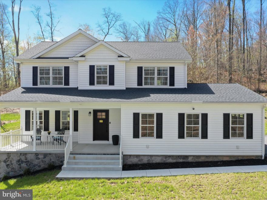 Welcome to the Carroll Valley!  Farmhouse charm and gorgeous custom features abound in this custom built home.  An inviting Stone Gas fireplace, family room off the open gourmet kitchen,  and a bright dining room separated by immense barn doors are just some of the outstanding features.
Enjoy beautiful granite countertops (and there are plenty), stainless steel appliances, gas stove,  mudroom  off the 2 car garage and an oversized pantry .  Luxury vinyl plank flooring fill the main level so gracefully , yet provide easy carefree maintenance.  There are 4 large light filled bedrooms and 2 full baths on the upper level, a ½ bath on main level, and a lower level full bath rough in. 

A vaulted ceiling in  the oh-so-spacious master bedroom is light filled and a perfect companion to the master bathroom . Perfectly planned with his and hers vanities,  gleaming designer tile, high end fixtures, faucets and a massive roman shower,  you might find your morning routine anything but!

Three large other bedrooms share a very spacious hall bath.  Having neutral carpeting and paint. This almost new home is a gem!

Situated on 2.67 luscious green acres with lots of open space to enjoy and use, the home sits perched on high ground.  A side facing -two car garage and mudroom -have  dual entry to the home. The level walkout lower level with bright double doors is heated and cooled, and is ready for your innovative designs for more finished space or prime storage. 

Want more? A spacious deck on the back, and rest-a-while porch on the front of the house are peaceful in any season.
Neighboring  historic Gettysburg and several major commuter routes, this lovely home is a stones to Liberty Mountain Ski Resort , Carroll Valley championship Golf Course, the rolling hills of South Central Pennsylvania, and the foothills of the Appalachian Mountains. A true staycation home. 

Join us at the Open House Saturday, April 19th 11:00 AM-1:00 PM.