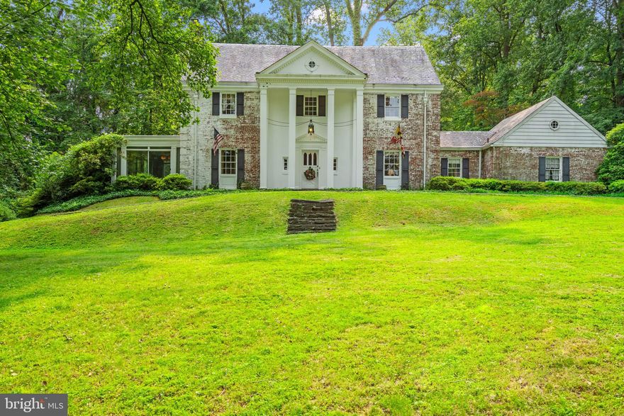 A Rare Estate Offering in the Heart of Bethesda.

Welcome to 6600 Bradley Boulevard, an exceptional opportunity to own one of the last expansive estate parcels inside the Beltway in close-in Bethesda. Gracing a gentle rise far set back from the road, this stately Georgian Colonial commands attention with its columned front porch and classic symmetry, offering both timeless elegance and unmatched potential.

Lovingly maintained by the same family for decades, the estate spans a verdant landscape of mature trees, lush plantings, and exquisite gardens that create a year-round tapestry of color and privacy. A circular drive with dual entrances introduces the home, offering a gracious approach that immediately conveys a sense of arrival—and of retreat.

Inside, the residence is filled with warm, inviting spaces ideal for both grand entertaining and intimate living. A marble-floored foyer sets the tone, leading to a generous living room with built-ins and a wood-burning fireplace with a European-style mantel, a formal dining room fit for large gatherings, a sun-drenched, south-facing solarium, a private study, powder room, and a spacious chef’s kitchen with adjoining breakfast room. The kitchen also provides direct access to a rear-entry, attached, two-car garage.

Upstairs, six well-proportioned bedrooms and three full baths span two additional levels, while the lower level includes a large recreation room with fireplace and wood stove insert, a built-in bar, laundry and utility rooms, half bath, and abundant storage.

With its expansive grounds and premier location, this rare offering invites limitless possibilities—from renovating and expanding the current residence, to building a custom dream home, or even subdividing the lot to create two exceptional properties. Whatever your vision, 6600 Bradley Boulevard offers a legacy setting of peace, privacy, and promise—just minutes from downtown Bethesda and Washington, DC.