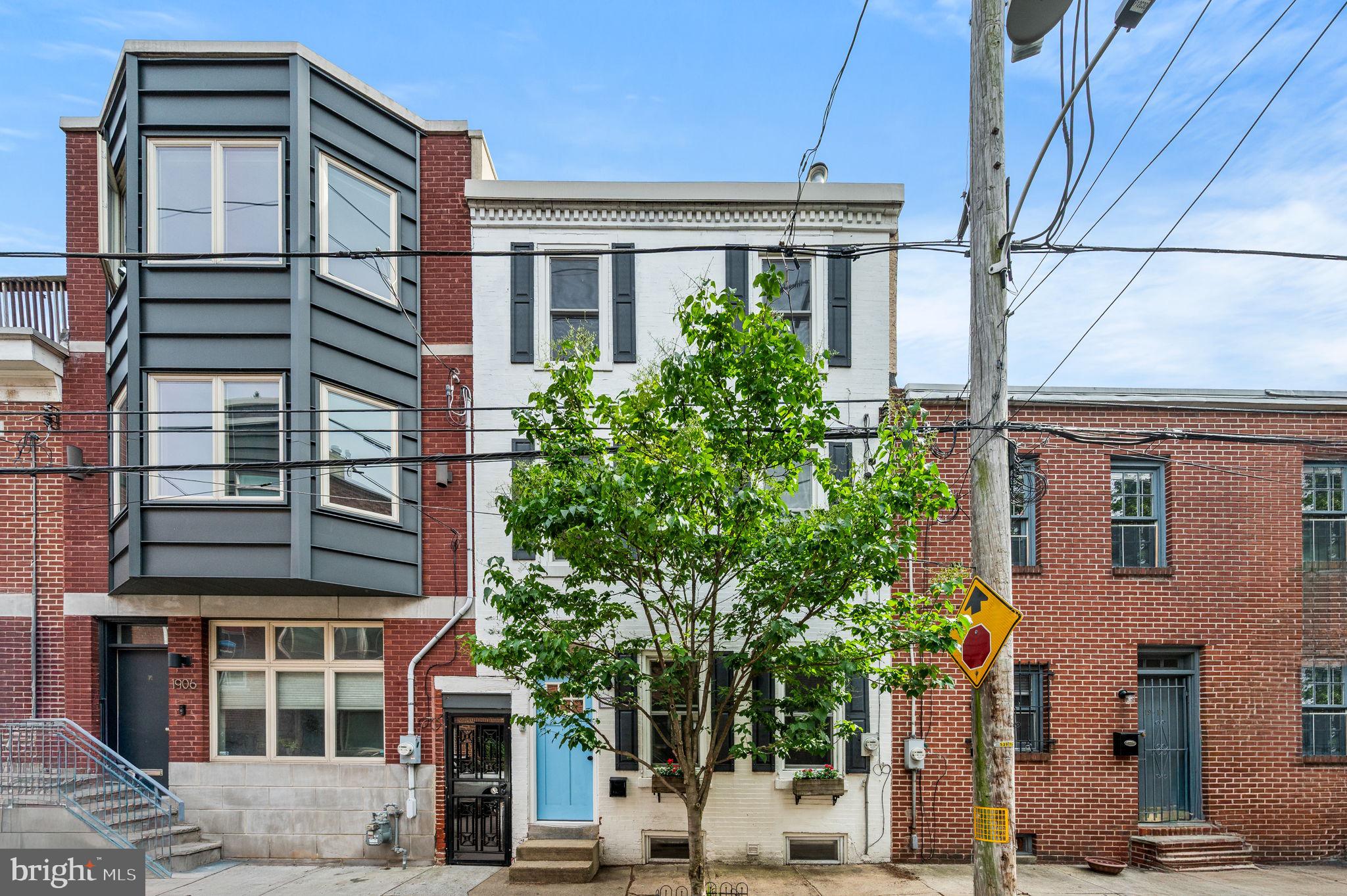 Tucked in the heart of the sought-after Graduate Hospital neighborhood, this charming 3-bedroom, 2-bathroom home strikes the perfect balance between city living and cozy comfort. Designed with both character and functionality in mind, the layout flows seamlessly from a spacious living area into an inviting eat-in kitchen—where French doors open to a private patio, ideal for your morning coffee or a relaxed evening dinner al fresco. Upstairs, the home opens up to a rooftop oasis with sweeping skyline views, perfect for hosting friends or unwinding under the stars. Whether you're entertaining or just enjoying a quiet night in, this home offers a unique blend of modern convenience and intimate charm—all within walking distance of local favorites, shops, restaurants and all that Rittenhouse Square offers, as well.