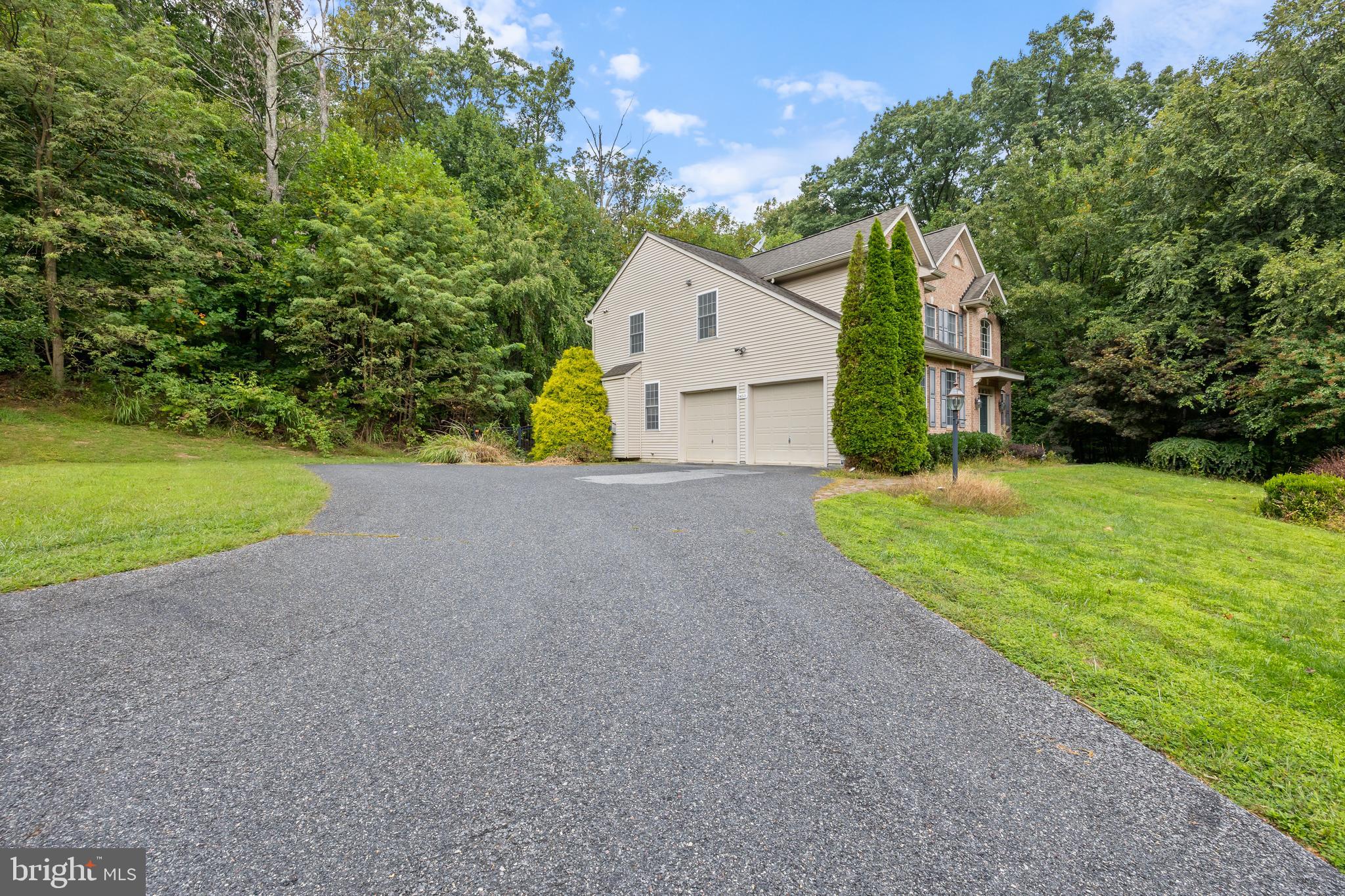 Welcome to this beautiful colonial with 4 bedrooms, 4.5 baths, a large chef's kitchen and an oversized island with granite and stainless steel appliances, living room, dining room, large deck, 2 car garage on 1.5 acres. This house is tucked away with plenty of privacy and plenty of trees. This home has almost 4500 sq. ft. of living space. This is priced low for a quick sale.