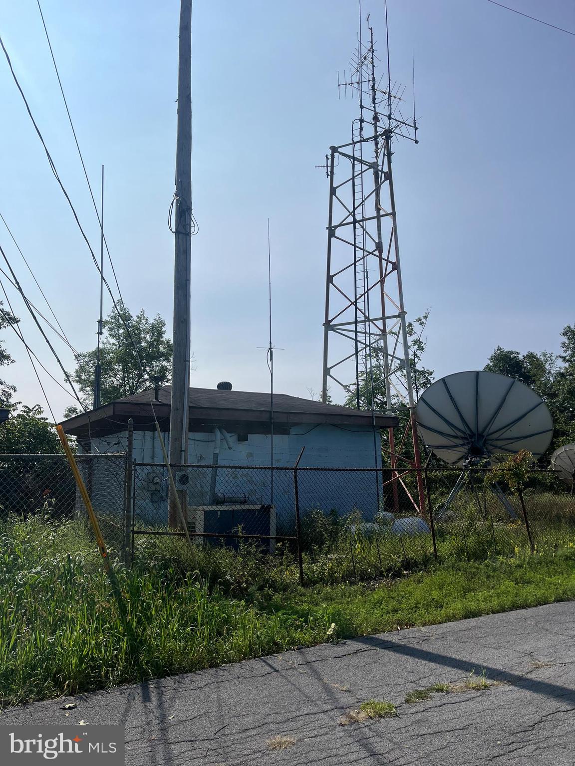 Currently tower is leased with 6 years remaining, possible room to add tenants, block building with electric, completely fenced. Sits on the top of North Mountain just West of Martinsburg WV I81 Exit 13