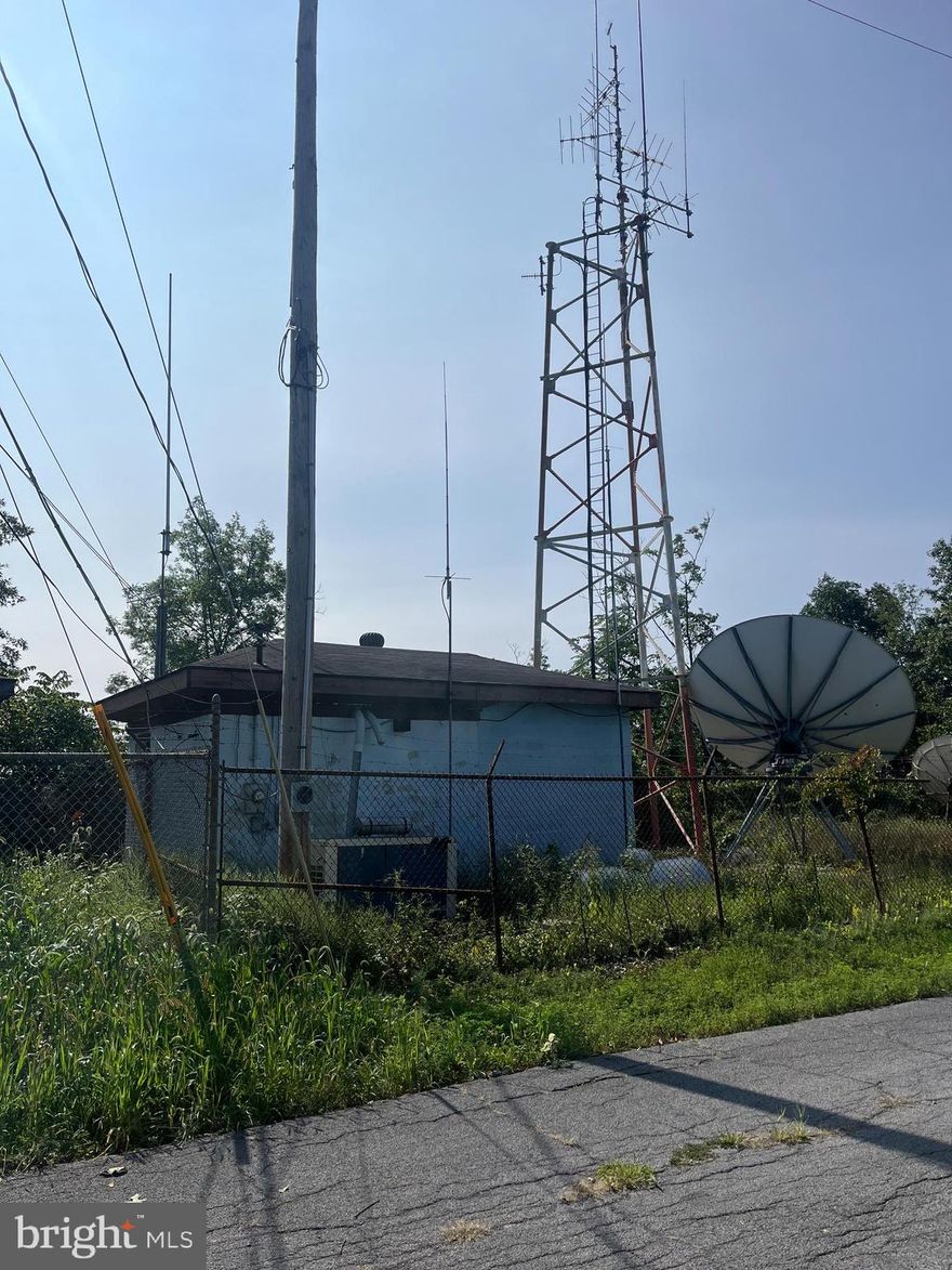 Currently tower is leased with 6 years remaining, possible room to add tenants, block building with electric, completely fenced. Sits on  the top of North Mountain just West of Martinsburg WV I81 Exit 13