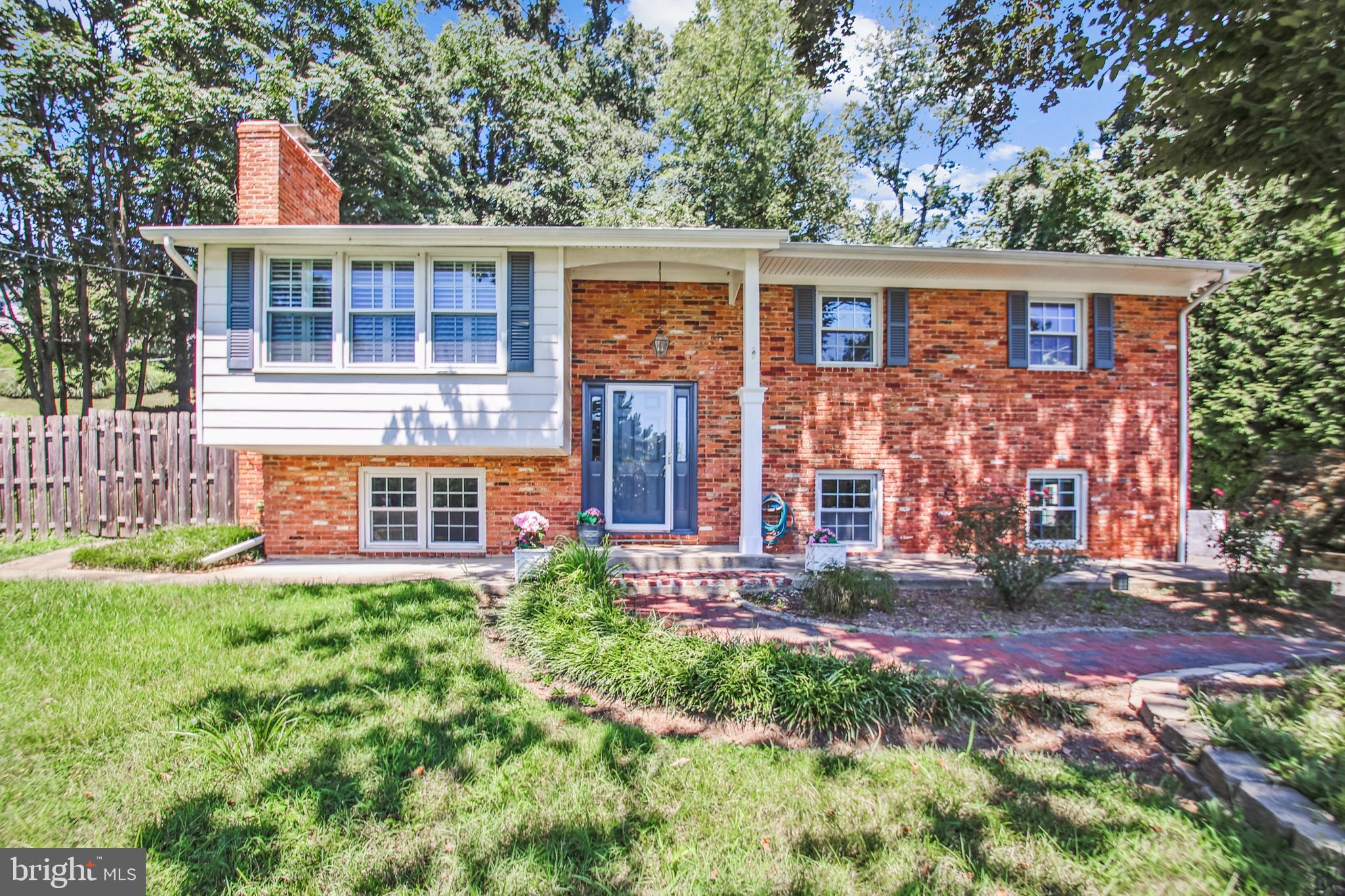 Lovely Hillsmere Split Foyer with 5 BRs, 2.5 Baths located in Private Water Community* Freshly painted throughout* Beautiful Refinished Hardwood Floors on Upper Level* Upper Level: Updated kitchen w/Stainless Steel Appliances, Quartz Counter Tops, Table Space for eat-in & Recessed lighting* Living Rm has Brick FP and mantel, Hardwood Floors, Bay Window with Plantation Shutters* Dining Area leads into Sun Room/Florida Room with Plantation Shuttered Windows and two sets of French Doors with access to Side Deck & Exterior Real Patio* Primary BR has lighted Ceiling Fan, Powder Room & Sliding Glass Doors with Access to Rear Patio* Two Additional BRs with Hardwood Floors* Hallway Full Bath w/updated tiled tib shower and floors* Lower Level: Additional Kitchen w/Toaster Oven, Microwave, SS Refrigerator, Moveable Island w/cabinets, Counter Top Burners* Family Rom has Brick FP & Mantel* Full Bath with tub shower* 2 Additional BRS* Laundry Rm w/built-in shelves* Backyard has Deck & Patio Areas* Hillsmere Community has plenty of Ammenities.*