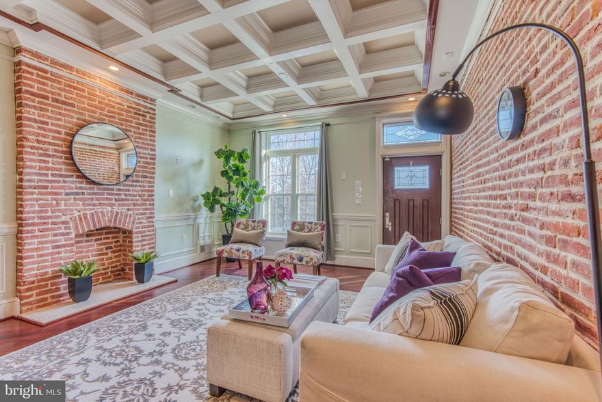 Gorgeous stone facade park front home!    This beauty boasts just under 3000SF of finished space, 3 above grade bedrooms, 3 full and 1 half baths with bonus room and lower level family room or guest quarters.  Lovely hardwood floors on the bias, custom lighting, and intricate trim work throughout.   Enormous chefs kitchen with cabinets for days and secondary sink.  3rd floor master suite with wet bar out to deck, his and her sinks, and spa like shower with multi point shower jets.  Multiple decks, rear patio, dual zoned HVAC, upper level laundry, and ample storage make this the perfect place to call home right next to Baltimore's biggest back yard!!!