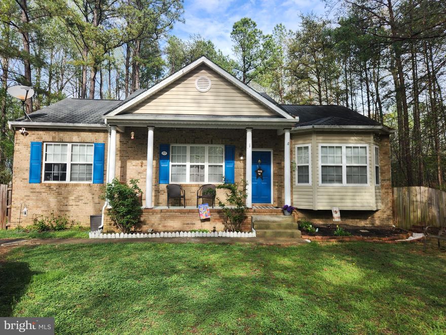 Discover the charm of this delightful ranch-style home nestled in the serene community of Lake Land 'Or with all of its amenities.  This inviting home features three spacious bedrooms and two full bathrooms, perfect for comfortable living. The heart of the home boasts a cozy gas fireplace, high ceilings, lots of natural light and new carpets in living room and bedrooms. The eat-in kitchen is open and inviting with space to gather.   The main floor primary bedroom with en suite is set opposite of the other 2 bedrooms, for comfort and privacy.  Off the kitchen is a large deck overlooking the backyard.  This lot backs to trees and NO neighbors behind to  feel like a peaceful retreat with beautiful landscaping, ensuring privacy and tranquility. Located on a cul-de-sac with no thru traffic, it is quiet with only a block's walk to the lake.   As part of a gated community, residents have access to a wealth of amenities, including a refreshing outdoor pool, basketball courts, tennis courts, and a clubhouse. Enjoy leisurely days at the beach or picnicking in the common areas, all while feeling secure with community maintenance and snow removal services. This home is not just a place to live; it's a lifestyle. Experience the perfect blend of comfort, convenience, and community in this lovely property. Don't miss the opportunity to make it your own!