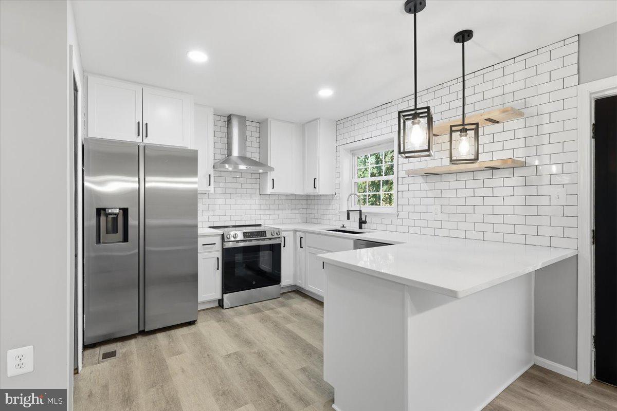 Step into this beautifully renovated 3-level brick front townhome offering the perfect blend of modern upgrades and classic charm. Enjoy brand-new kitchen cabinets, sleek quartz countertops, designer tile backsplash, and stainless steel appliances, all opening to a light-filled main level with gleaming hardwood floors and fresh designer paint throughout. There are updated bathrooms, new lighting, new flooring and a cozy fireplace. The fully finished lower level walks out to a private, fenced backyard and patio and a large deck off the kitchen is perfect for entertaining or relaxing. Hurry this will not last!