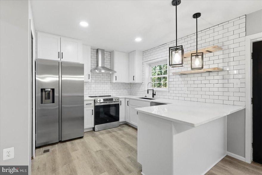 Step into this beautifully renovated 3-level brick front townhome offering the perfect blend of modern upgrades and classic charm. Enjoy brand-new kitchen cabinets, sleek quartz countertops, designer tile backsplash, and stainless steel appliances, all opening to a light-filled main level with gleaming hardwood floors and fresh designer paint throughout. There are updated bathrooms, new lighting, new flooring and a cozy fireplace. The fully finished lower level walks out to a private, fenced backyard and patio and a large deck off the kitchen is perfect for entertaining or relaxing.  Hurry this will not last!