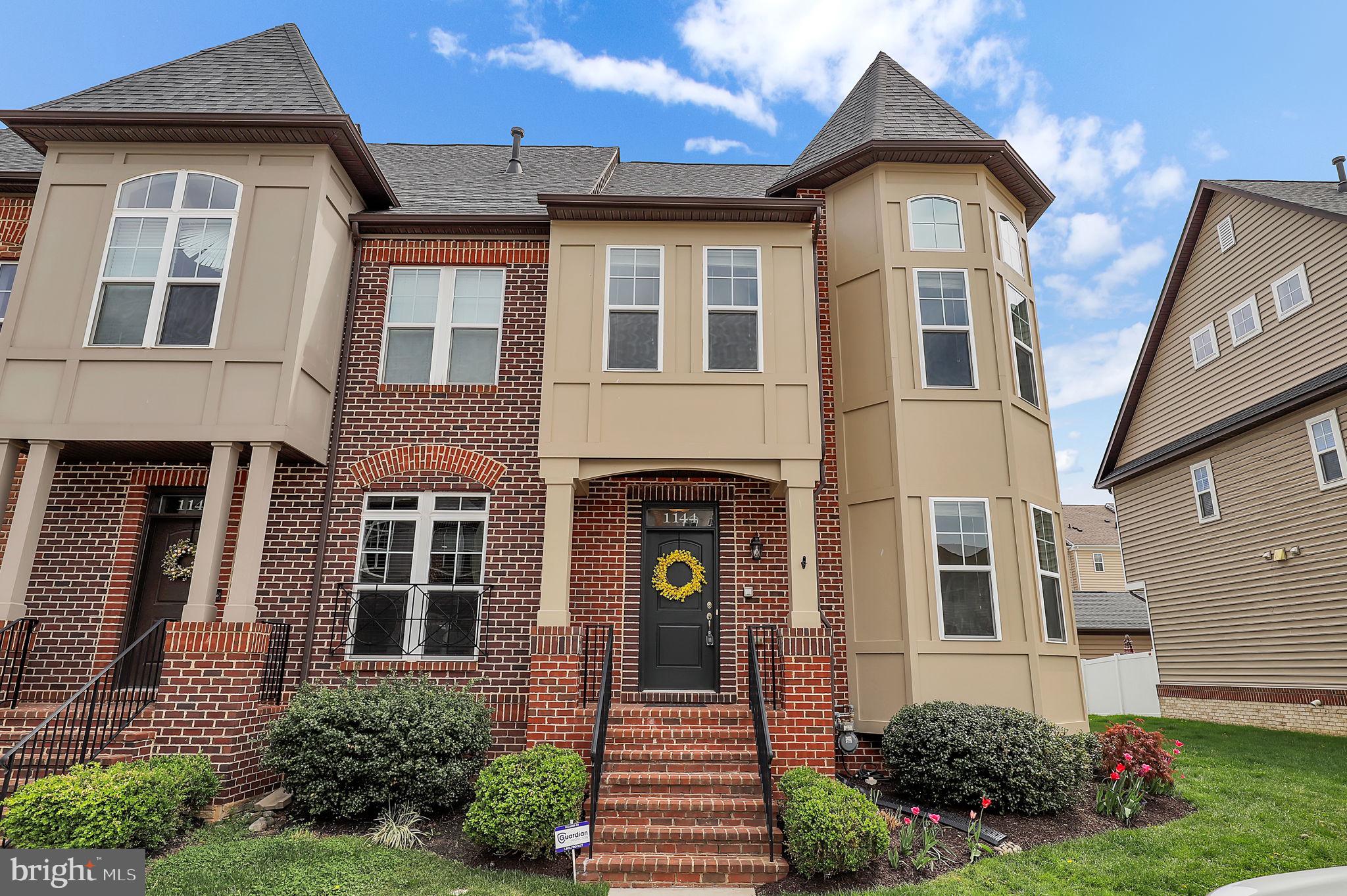 Welcome to this beautifully maintained 2,500+ sq ft END-unit townhome in sought-after East Church. The main level offers an open-concept layout with hardwood floors, a gourmet kitchen featuring granite countertops, an oversized island, and a gas fireplace in the spacious living area. Upstairs, enjoy a large primary suite with dual closets and a spa-like en-suite, plus two additional bedrooms and a stylish hall bath. The loft level includes a wet bar, another gas fireplace, and opens to a covered/uncovered rooftop terrace—which also features a second fireplace, located outdoors—perfect for entertaining. The finished lower level offers a flexible space ideal for a gym, office, or guest room. Outside, enjoy a custom paver patio, detached 2-car garage, and beautifully landscaped yard. A quick walk to downtown Frederick along sidewalks from this location—community amenities include a pool, clubhouse, and playgrounds.