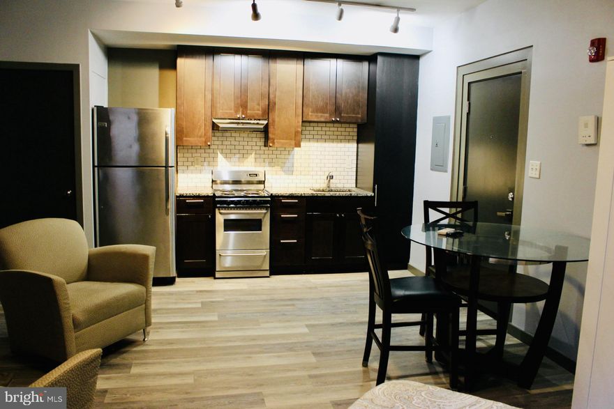Welcome to 842 Park Avenue, a charming retreat in the heart of Baltimore’s vibrant Mt. Vernon neighborhood! This delightful furnished studio apartment offers the perfect blend of comfort and convenience, making it an ideal home for those who value style, functionality, and the perks of city living.

Inside, you’ll find everything you need to feel right at home. The in-unit stackable washer and dryer make laundry a breeze, and your very own private bathroom ensures comfort and privacy. The building features a secure entry system, so you can welcome your guests with ease and enjoy peace of mind.

Step outside, and you’re instantly immersed in one of Baltimore’s most walkable and dynamic neighborhoods. With an impressive 99 Walk Score, Mt. Vernon invites you to explore its tree lined streets filled with cozy cafes, renowned restaurants, and charming shops. Cultural gems like the Walters Art Museum and local theaters are just a short stroll away, offering endless opportunities to relax and indulge in the arts.

Parking is simple and flexible. Just apply for a neighborhood parking pass through the Residential Parking Authority of Baltimore City to enjoy nearby street parking,  opt for garage parking just across the street for added convenience (available for an additional fee) or park in the 1 private parking spot behind the building for an additional monthly fee of $135.

To top it off, this dog friendly building welcomes your furry friends, making it a true haven for pet lovers. Whether you're savoring the beauty of Mt. Vernon or embracing the lively energy of city living, 842 Park Avenue offers a lifestyle like no other.

Come and see for yourself why this would be the perfect place to call home!