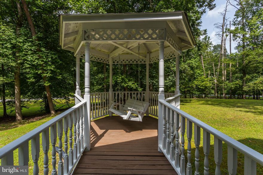 A rare find...4 Bed/2.5 Bath on almost 1.8 acres in a Community & NO HOA!! So many updates! New Roof, All New Carpet & Flooring, Newly Renovated Master Bath, Full Bath Upstairs and Half on Main! Home Freshly Painted Inside. New HVAC & Water Heater too! Large Deck off the Back & attached Gazebo off the front porch w/Swing to sit & watch deer go by Close to Commuting Options & Shopping!