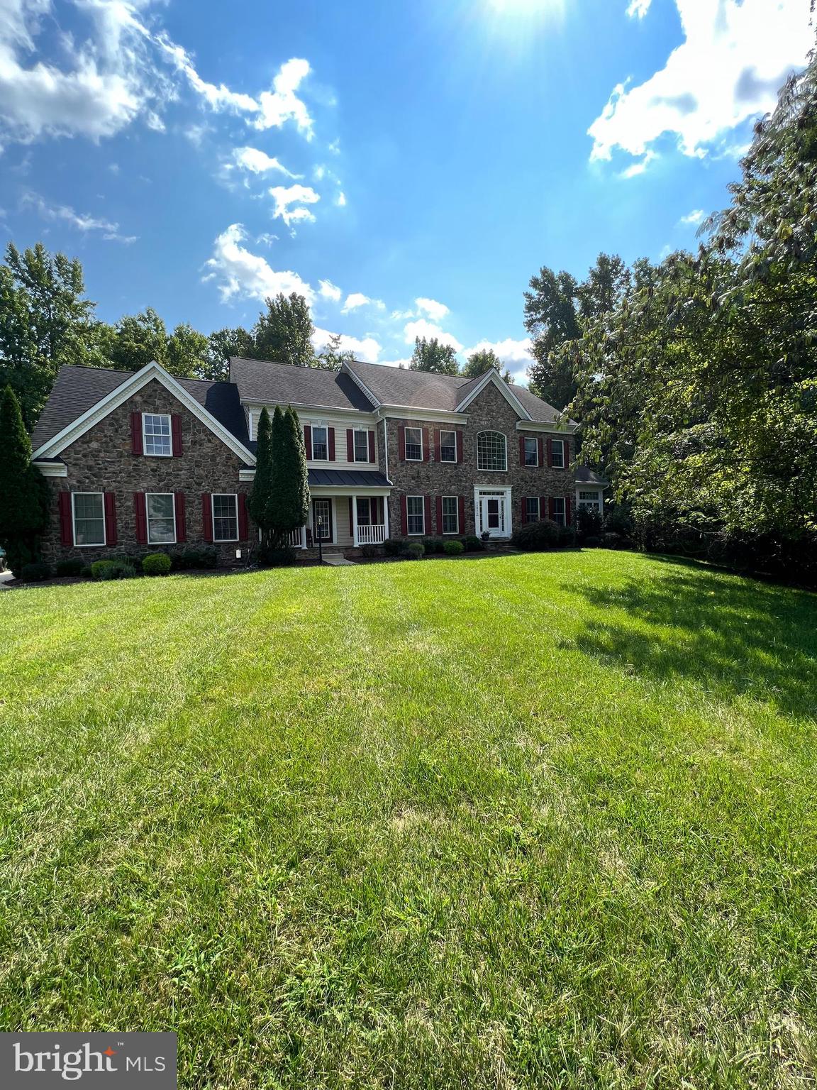 Back to Fully Available: Buyer unable to secure financing!!!!!!Great news 60K price reduction Your wait is finally over, Welcome to 14811 Dolphin Way nestled in the highly sought-after Bowie “Woodmore Estates”! Christmas in November!!!!!This crown jewel is situated on .93 acres wooded home site. Elegant Stone front colonial 5 bedrooms 4.5 baths 2 story foyer and 2 story family room, 3 car garage. Main living area offers duel staircase “Juliette balcony” formal dining room with tray ceiling, living room with tray ceiling, 3 piece crown and chair rail molding, conservatory with floor to ceiling windows for the optimal wooded view, oversized ceramic floor tiles, tray ceiling, custom lighting features, generous size first floor office, 2 story extended family room gas fireplace, gourmet kitchen, granite bullnose counter tops, 42” raise panel oak custom cabinets, porcelain double sink, center island gas downdraft cooktop, double wall ovens, walk in pantry, butler pantry, secretary desk. Custom lighting and window treatment through property. Morning room, Mud room, laundry room with utility sink, secondary front entrance. Upper primary living area, 4 generous size sleeping quarters, full walk-in closets, Jack and Jill bath, one additional private bathroom, Huge Primary suite, tray ceiling, private sitting room duel custom walk-in closets, deluxe opulent spa bathroom, double vanity, jacuzzi tub, standalone shower, custom tile flooring. Plush wall to wall carpet in all sleeping quarters. Gleaming hardwood plank flooring on main level. Massive fully finish basement, entertainer paradise with in-law suite. Basement walk up area way exit. Composite deck, screen in porch with electricity, 3 car garage custom protective garage flooring, garage organizer, irrigation system, solar panels, landscaping lighting package. All bedrooms have ceiling fans, property comes with a total of eleven. Three zone HVAC. Newly replace items (2 HVAC units, kitchen cooktop, dishwasher, garbage disposal, 60-gallon hot water tank) Schedule your private showing.
