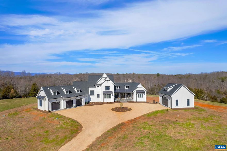 What a gem! Enchanting custom built home on 21 acres backing up to the Rivanna River with in-law suite with two bedrooms and a sunroom which would be perfect for family, guests, or an au pair. The primary bedroom suite is spacious with vaulted ceiling, large walk-in closet and attached bathroom with a relaxing soaking tub to melt away your stress. The main kitchen has more than ample space with island, gas range, recessed lighting and a very large pantry! The home also features an attached three car garage which opens to a mud room as well as a detached two car garage complete with electric, heating and cooling. The upper-level features three bedrooms, two full bathrooms, sitting area as well as an additional laundry room. The lower basement area already has a full bathroom and plenty of potential for additional living space. Rest easy with the full house generator. Lovely wood and tile floors throughout the home. Outdoor area has a covered porch in back as well as an in-ground pool with security cover for summer fun! 21 acre parcel with Rivanna River access. Truly a delightful home!,Granite Counter,White Cabinets,Fireplace in Great Room