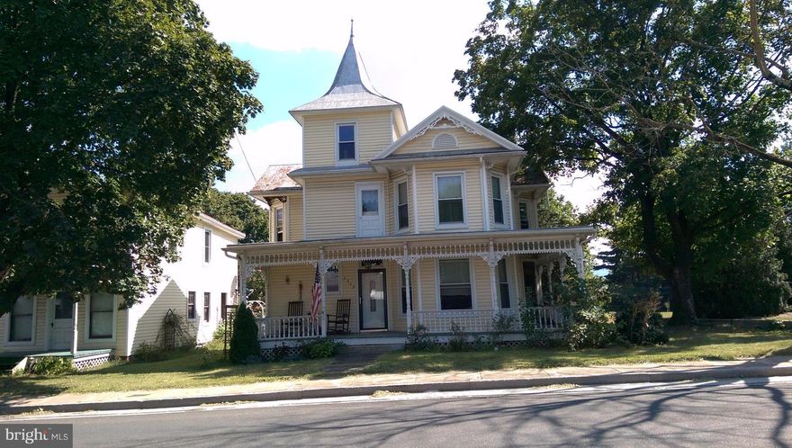 Small town USA on Main Street. Victorian style home needs some TLC.  Large fenced yard, off street parking. Large two story building could be used as workshop, store front or guests. Being sold AS IS!!