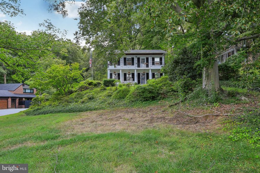 Welcome to 703 Hillen Road, a charming Colonial-style detached home in a prime Towson location. This residence offers three bedrooms, two full bathrooms, and one-half bath with a traditional floor plan. Interior features include a mix of hardwood and carpet flooring, as well as a new HVAC system installed in 2023 for added comfort. The home sits on over an acre of land, highlighted by blooming azaleas and a natural stream at the rear of the property. Outdoor living spaces include a deck and two bedrooms with access to private balconies, providing great spots to enjoy the surrounding views. An attractive 3.75% assumable loan adds even more value and opportunity for qualified buyers.