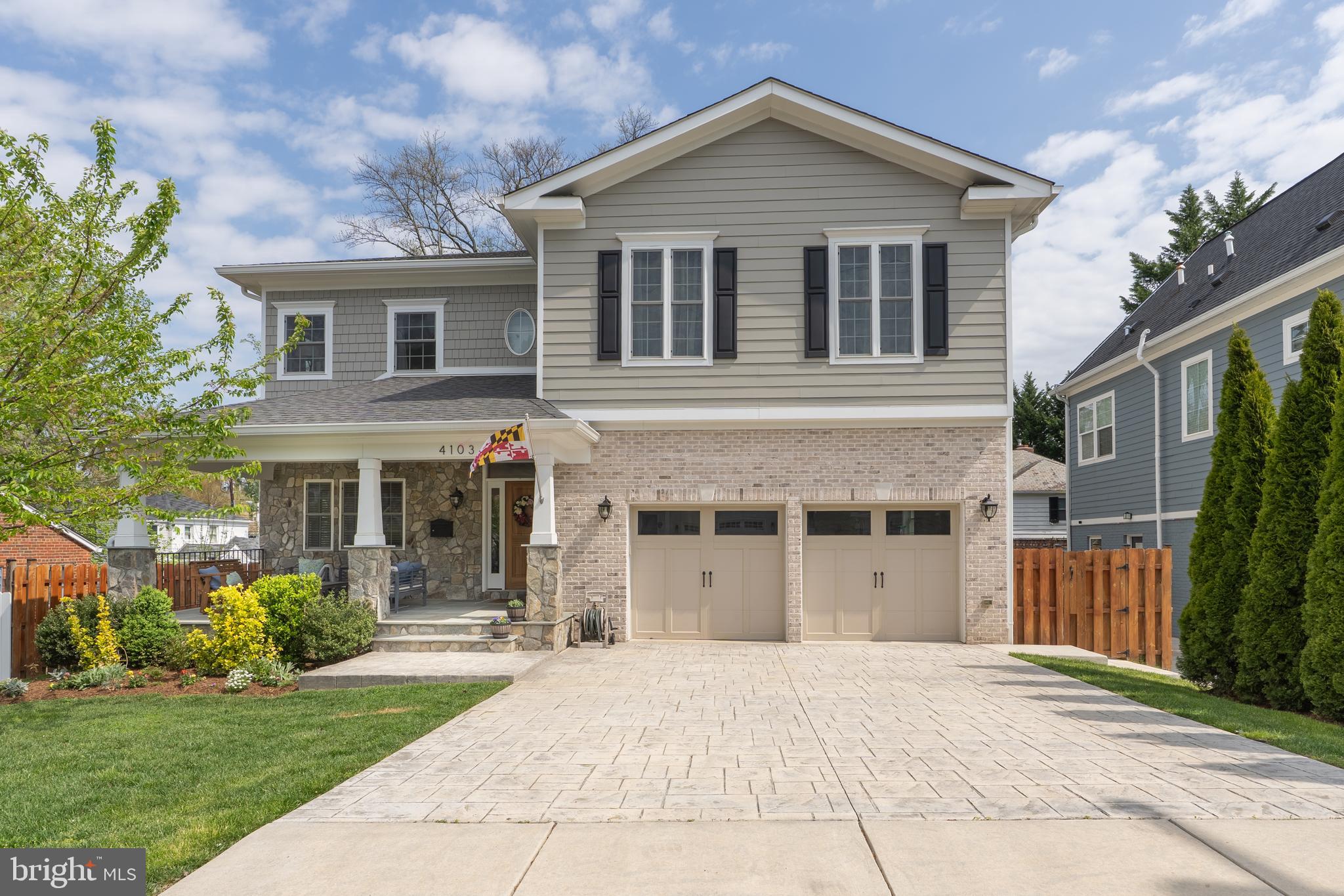 Recently built among the tree-lined streets of Kensington, this 5 bedroom and 4.5 bathroom home with two car garage and over 4,000 square feet of living space displays the perfect union of traditional finishes with a modern sensibility. A gracious covered front porch provides a warm welcome and true outdoor living space with southern exposure. The entryway opens to a large dining room with two walls of windows and warm oak flooring that continues throughout the upper levels. To the rear of the main living area, an open plan living area boasts dual exposure with windows flooding the space with natural light, from the cozy, yet modern stone fireplace to the breakfast area and well appointed kitchen. With waterfall quartz countertops on the vast island, a sleek stainless steel appliance suite, including two ovens and an apron front sink, the marriage of traditional and modern is best demonstrated here at the heart of the home. Sliding glass doors provide access to the spacious rear deck and backyard. Upstairs, the primary suite features dual exposures to the south and east, with incredible natural light, an enviably large walk-in closet, and marble clad en-suite bath with dual vanity, deep soaking tub, glass enclosed shower, and separate water closet. A second full suite with tub shower, as well as two additional bedrooms with Jack-and-Jill ensuite bath, and conveniently located laundry room with side-by-side high efficiency appliances complete the upper level. Descending to the lower level, any worry of a cold, dark basement quickly fades away as large egress windows provide natural light, and reveal a perfect second living room retreat, fifth bedroom with adjacent full bath, excellent storage, and a den, currently used as a fitness room. Downtown Kensington, replete with easy access to groceries, restaurants, beautiful parks, a craft brewery, antique shops, and Kensington MARC station to name a few, is a true lifestyle destination. Well connected to nearby communities and the District, but in a league of its own