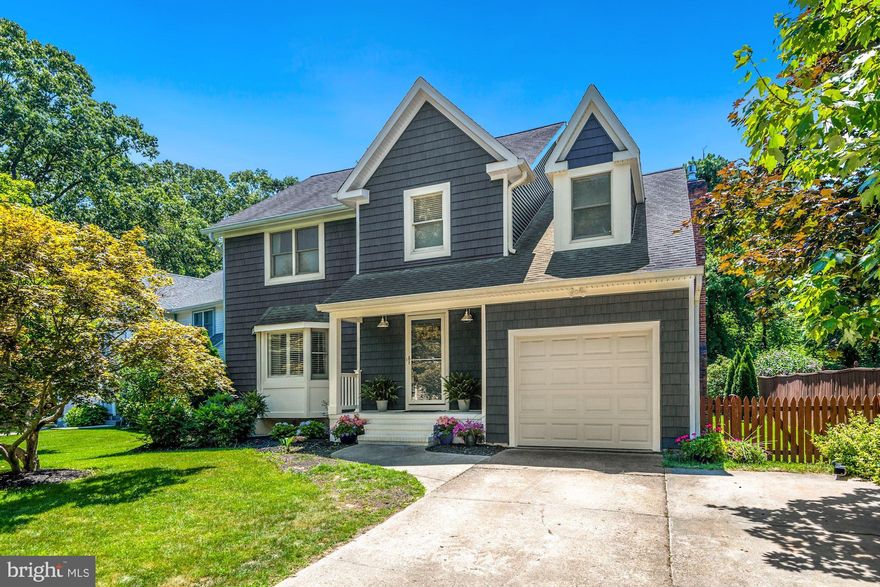 **Offer Deadline - 5PM, Monday August 15** Gorgeously updated colonial in desirable water-access Severna Park neighborhood!  Brand new shake siding, a newly redone porch and a new entry door welcome you in from the tree-lined street to this wonderfully light-filled home.  Beautiful hand-scraped birch hardwood floors run throughout the main level, including the gourmet kitchen, with its white cabinets, quartz counters, stainless appliances and subway tile backsplash.   The kitchen is open to the relaxing family room, with a gas-burning fireplace and french doors lead you out to the newly added screened-in porch and deck, creating the ultimate indoor/outdoor entertaining space!  The oversized porch is perhaps the most inviting room in the house, featuring low maintenance trex decking and vinyl rails, telescoping vinyl windows, which can make this space comfortable to use much of the year, and of course, shiplap siding.  New deck features low maintenance materials as well, and leads to the level, fully-fenced rear yard, backing to trees and giving serenity and privacy to an already amazing space.  The dining room, living room with its huge bay window and plantation shutters, and the fully renovated powder room complete the main level.  The upper level features 4 generously-sized bedrooms, a newly renovated hall bath, and an upper level laundry area.  The primary suite features a walk-in closet and a brand new en suite bath featuring a new walk-in herringbone marble tile shower, navy vanity with marble top, tile floor and brushed brass finishes (renovation to be completed next week).  A finished basement and attached garage round out the spaces inside this incredible house, but the neighborhood offers so much more!  Amenities in this amazing social community include a scenic wooded walking trail only steps from the house,  a tot lot with multiple play areas, as well as picnic and firepit areas, and water access, with kayak racks and a pier on the Magothy River.  Community events throughout the year including an Easter egg hunt, fall festival/Halloween party and more.  Blue Ribbon Severna Park schools!