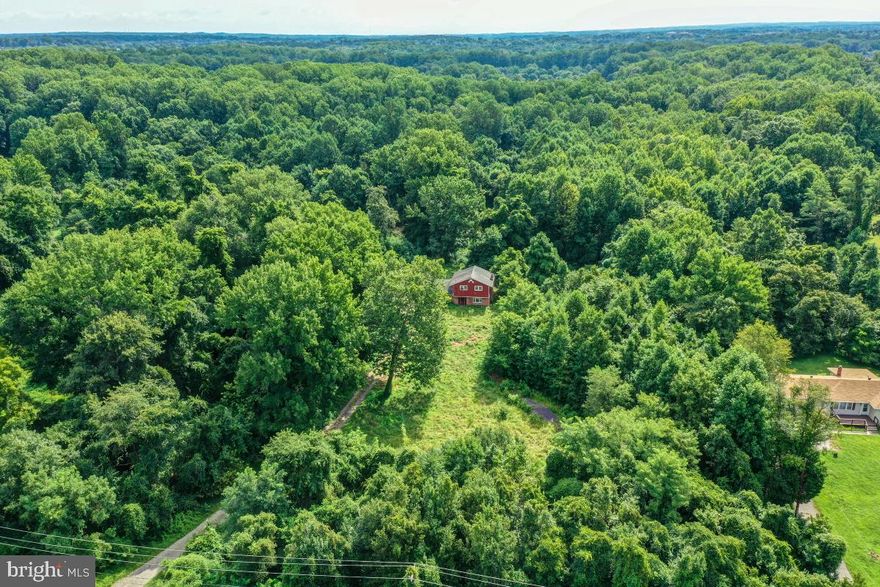 Attention builders, developers, and dream home buyers seeking sought after Bowie. This lot of 9.93 acres is wooded land. Please do not disturb the property caretaker living in the house. The value is in the land, and it can be subdivided. There is public water and sewer hook-up available. The entire property is sold As Is and suited for developers, non-profit organizations and individuals looking to create their dream home or family estate. Buyer will have to do their own due diligence for specific details by calling Prince Georges County.   The lot is surrounded by the communities of Fairwood, Old Stage Knolls, nearby Woodmore and new construction single family homes. Conveniently located near Woodmore Towne Centre, the new University of Maryland Regional Capital Region Medical Center and schools. Easy access to major roadway routes and public transportation. Are you interested? Tell your agent to contact me.