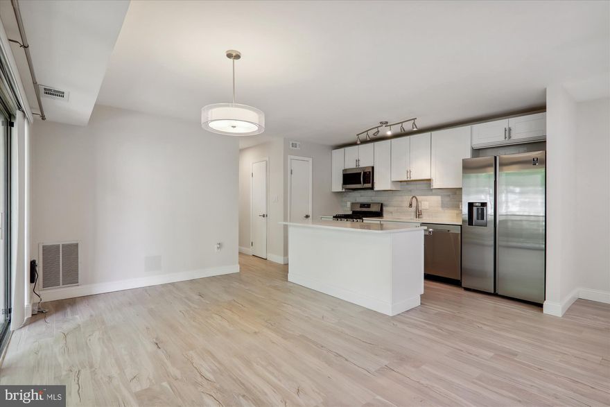 Fully renovated 2 bed/2 bath condo and you will find that it has been updated to today's standards.  LVP flooring throughout w/ an open floor plan.  The spacious living areas such as the living room, dining room, and spectacular kitchen lends to everyday living and entertaining.  The kitchen is equipped w/ stainless steel appliances, oversized island, and pantry.  As you walk into the hallway the leads to the bedroom, there is a walk-in closet.  The two bedrooms are spacious, including a primary bedroom w/ a walk-in closet and beautiful bathroom.  Don't forget the updated hall bathroom.  The updates in this condo are tastefully done w/ sparkling tiles and neutral choices.  There is also a nice deck that can be enjoyed by all.  Don't lift a finger.  Just move in.  All utilities, gas, and water included in the condo fee.  Plus, trash, snow removal, tennis courts, playground and pool.  Conveniently located to metro, parks, shops, etc.