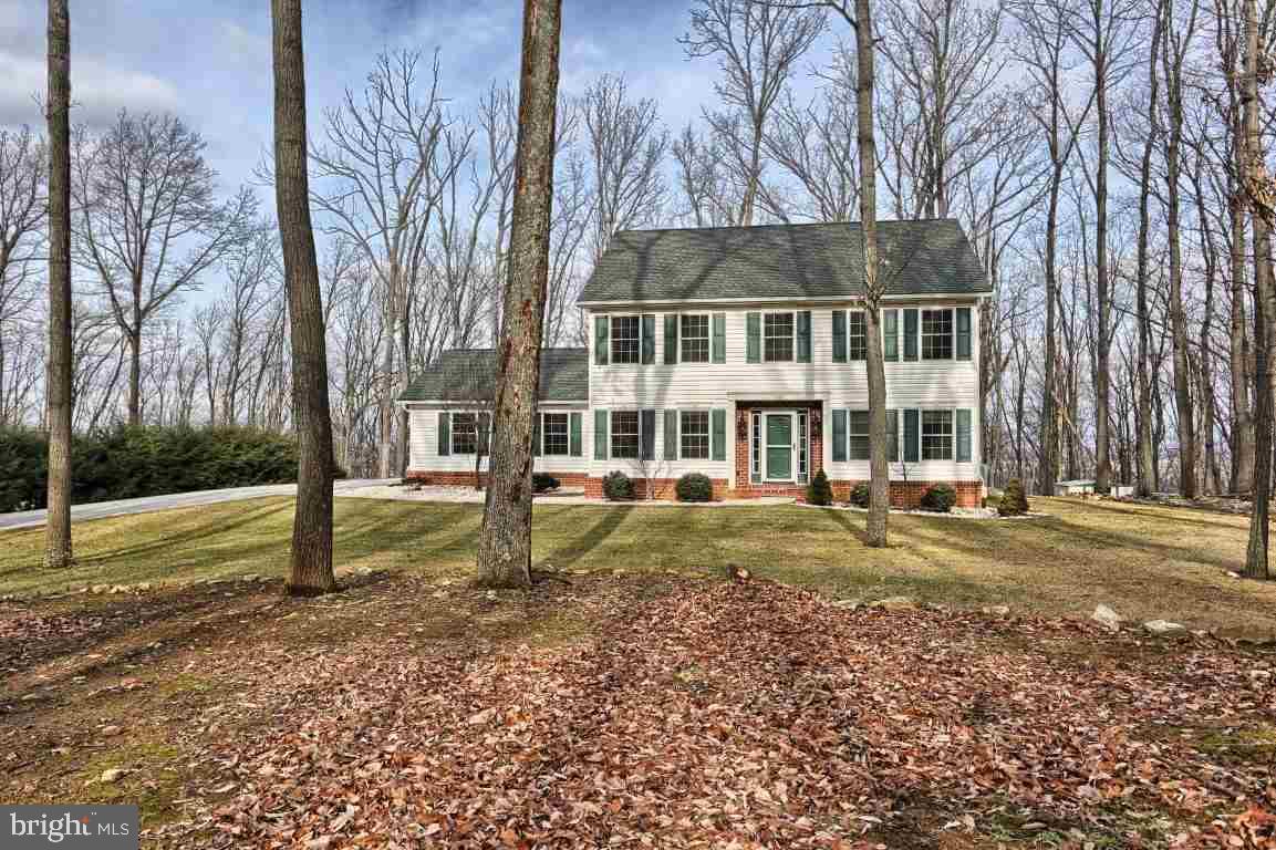 They don't come along like this very often. One of the newest custom built homes in White Rock Acres in the sought out Cumb Valley School Dist. A masterfully constructed home in a park-like, private setting on over 1 acre of wooded privacy, and it can be all yours! The curb appeal is one your friends will envy. Large rooms everywhere. Amenities like a beautiful stone fireplace, quartz kit countertops, huge walk in kit pantry, master with cath ceilings, nearby hiking trail connects to the Appl. Trail, & more