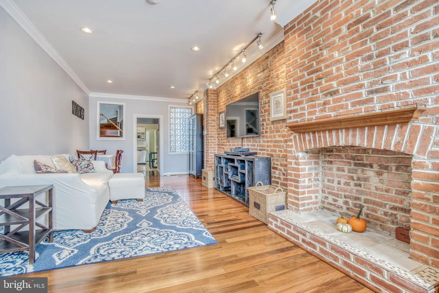 Well cared for 2 bedroom 2 bath home in superb Canton location!   Fall in love with the charm of exposed brick, hardwood floors, decorative fireplace, newly updated kitchen, and easy PARKING PAD!  Convenient main level laundry, bonus space upstairs for office or sitting area,  en suite guest bath with charming claw foot tub, and interior access for buyer to potentially add a roof deck.    Buyers have updated the following in their tenure: Water heater,  washer/dryer, all kitchen appliances, and main water line to house was replaced.