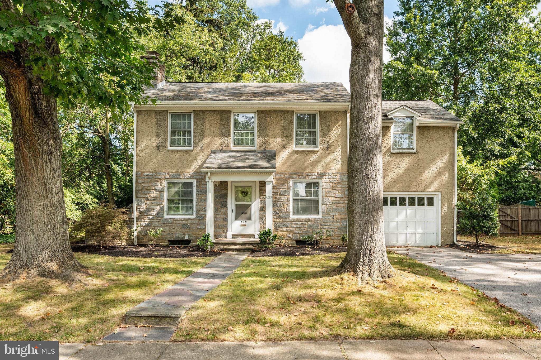Don't miss this wonderful opportunity to own a beloved home in Swarthmore Borough - a picturesque college town known for its tree-lined streets, charming downtown and walkable lifestyle. Walk to train, schools, town, playgrounds and more. Lovingly maintained by the same family for 60+ years, 629 University Place has had only two owners in its lifetime. This lovely stone home is filled with character and charm and is ready for its next chapter. While cosmetic updates are needed, the potential is limitless.
First floor features a spacious Living Room with wood-burning fireplace, Dining Room, Powder Room, Kitchen and a delightful three season SunRoom at the rear of the home - perfect for morning coffee or unwinding in the evening. A single car garage is conveniently accessed through a doorway off the Kitchen.
Upstairs you'll find three generously sized Bedrooms plus a small Office. One Bedroom includes an attached Powder Room, with space to potentially expand into a full ensuite Bath. The Hall Bathroom offers a tub/shower combination. A staircase off the Office leads to the walkup Attic, providing terrific storage and possible expansion potential. The full, unfinished Basement offers even more space and flexibility. Outside, the backyard features a generous fully fenced in area - ideal for play, gardening or pets. Enjoy everything Swarthmore has to offer - from the seasonal Farmers Market and Food Truck-A-Thons to the public library and SEPTA Train Station to Philly. You'll appreciate the award-winning Wallingford-Swarthmore Schools, easy access to all major highways and Philadelphia International Airport (just fifteen minutes away). This is your chance to bring new life to a well-loved home in an unbeatable location. Showings start Thursday, 9/18 at 3 pm.