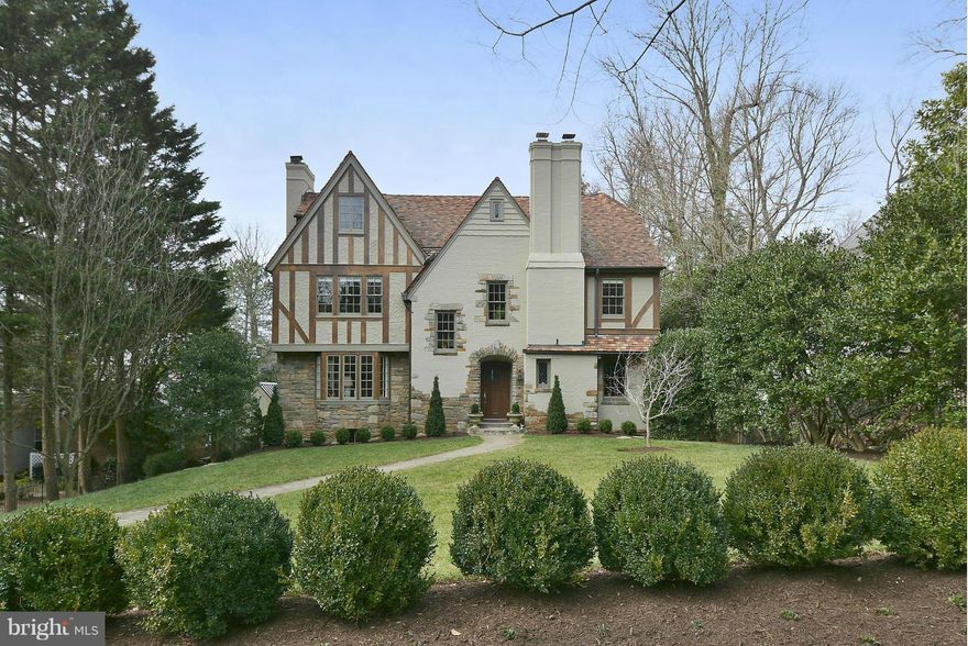 1928 Tudor..Spectacularly Landscaped .3 acres. Exquisite Renovation - Foyer -  large living room,  screened porch, elegant dining room, sweet library/den with fireplace & powder room, modernized kitchen (six burner wolf range., etc) 2nd level - spacious Master suite, glorious bathroom, 3 bright bedrooms 2 bas. 3rd Level with 3 brs/offices/studio and full bath..Lower level family room - 2car Garage