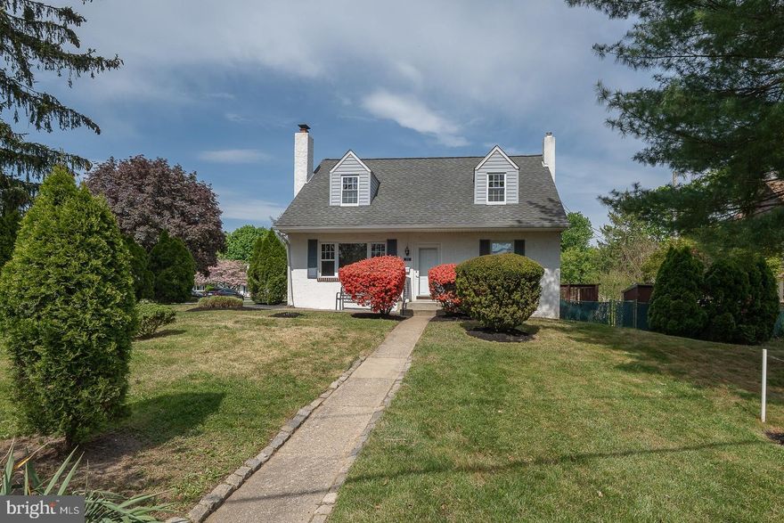Welcome to this well-maintained, move-in-ready Cape Cod in the highly sought-after Springfield School District. This 3 bedroom, 1 bath home offers curb appeal and ease of living, featuring a convenient driveway with side-street access for effortless parking. Step inside to discover an inviting, light-filled interior boasting fresh paint and hardwood floors throughout. The living room serves as the heart of the home, centered around a classic brick fireplace that creates a warm and cozy atmosphere. For those who love to entertain, the formal dining room flows seamlessly into the eat-in kitchen, which features freshly painted cabinetry with new hardware, a tiled backsplash, and direct access to the private deck and side yard. The main level is thoughtfully designed with a comfortably sized bedroom and a full hallway bath. Upstairs, you will find two additional generously sized bedrooms, both featuring ample closet space and charming architectural lines. The full basement is perfect for laundry and all your storage needs. Outdoor living features a large front yard, a fully fenced side yard and a total of two storage sheds—one in the front and one in the side yard—providing plenty of room for landscaping equipment and seasonal gear. Perfectly situated near major commuter roads and local shopping. Schedule your private tour today!