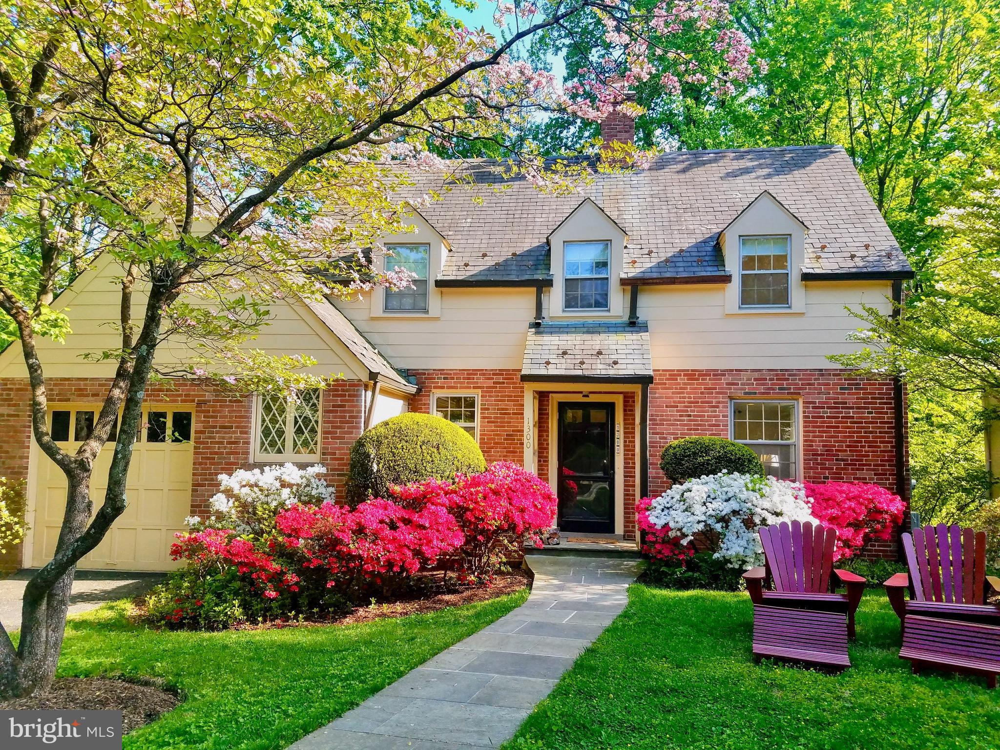 Welcome to your dream home in the heart of Woodside Park! This classic 1937 brick Colonial offers the perfect blend of timeless charm and thoughtful updates on a nearly 10,000 sq ft quiet lot.
Step inside to a light-filled main level designed for both everyday living and entertaining flow. The updated kitchen features stainless appliances, quartz countertops, solid oak cabinetry, and an adorable breakfast nook. A cozy living room with wood-burning fireplace, custom built-ins, and a spacious dining room create warm, inviting spaces for gatherings.
Upstairs, you’ll find three generously sized bedrooms, including a primary with a walk-in closet, plus a hall bath showcasing vintage tile that adds original character. Gleaming hardwood floors extend throughout, enhancing the home’s natural elegance.
The fully finished lower level expands your living space with a versatile family room or guest suite complete with full bath, an office nook, a second wood burning fireplace, abundant storage, and convenient rear access to flagstone patio and yard.
Outdoors, enjoy beautifully landscaped gardens, a secluded backyard with room to expand, and a one-car garage equipped with EV charging. The home’s slate roof and quality upgrades underscore its lasting value.
All this in a neighborhood prized for its tree-lined streets, just moments from Sligo Creek trails, Metro, downtown Silver Spring, and shopping. History, character, and modern convenience come together in this Woodside Park gem-don’t miss it!