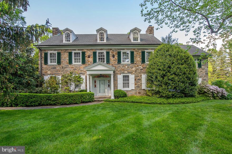 This Impressive Stone Colonial Manor Home is an Architectural Masterpiece and Horticultural Dream. This home sits prominently on an exceptional 2.26 acre lot in the heart of the prestigious North Rose Lane neighborhood in the community of Northside Haverford.  Dating back to 1935 this exquisite home features old world charm, unparalleled craftsmanship, beautiful woodworking and many updates thruout.  Interior features include an impressive Thru Center Hall with stunning staircase and winding balcony flanking the entrance to the Formal Living  Room with Fireplace and the large elegant Dining Room also with Fireplace. The Living Room leads to a stately mahogany study/ den with beautiful fireplace with stone surround, and built ins and French door to lovely brick patio with stone walls overlooking magnificent grounds. The Dining Room leads to large Butlers Pantry with an abundance of white display cabinetry and stunning brass bar sink adjoining an expanded white kitchen with large granite island and ample white cabinetry and breakfast and desk area with large sliding glass door overlooking magnificent courtyard and grounds and access to three car garage. Second Floor features a large master suite with wood burning fireplace and adjoins sitting/ dressing room/ office. Multiple Bedrooms and adjoining baths are on the second level. Third floor offers 2 more bedrooms and 2 baths or large upstairs family area. The exterior of this wonderful home offers total privacy and magnificent mature landscaping , impressive gardens blooming at all different times, plenty of room for a pool and/ or court, a charming front portico entrance, an expansive rear brick patio with stone walls overlooking courtyard gardens and exceptional grounds. The versatile floor plan and wonderful flow make this home perfect for both active family living as well as elegant entertaining.  Offering many new amenities combined with the charm and elegance found only in an older home, this exceptional home is conveniently located in the heart of the Main Line within walking distance to downtown Haverford and the local shops, restaurants and the train station, minutes to Suburban Square, Ardmore and Bryn Mawr and it is within close proximity to all major highways for commuting to Center City or the airport.