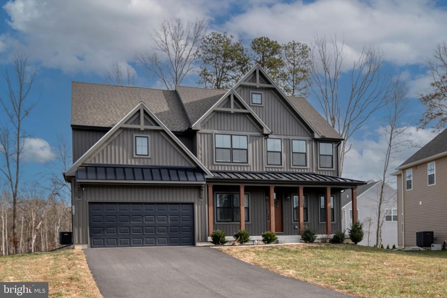 From the moment you pull up, this home just feels special. 
 
This nearly new Parker Model in the sought-after Cool Springs community blends modern design with warmth and character in a way that’s hard to find. Thoughtfully customized in collaboration with a professional interior designer, every detail was chosen to feel intentional, stylish, and livable. 
 
The exterior immediately sets the tone with moody board-and-batten siding, black vinyl windows, wood columns, metal roof accents, and an oversized 8-foot front door that makes a statement before you even step inside. Once you do, you’ll notice the 9-foot ceilings, extra recessed lighting, and a layout that flows beautifully while still offering distinct, usable spaces. 
 
Just off the entry, a charming home office sits to one side—perfect for remote work or quiet reading—while an inviting living room on the other feels ideal for cozy evenings or hosting guests. Moving further in, the heart of the home opens up into a spacious family room with a gas fireplace, seamlessly connected to a cook’s kitchen designed for real life. You’ll love the upgraded appliances, gas range with vent hood, Corian countertops, large center island, and an impressive walk-in pantry. This open living and dining space is where everyday moments happen—meals, conversations, and memories. 
 
Upstairs, the primary suite is a true retreat. It’s generously sized yet cozy, highlighted by elegant picture-frame molding in a rich forest green. The spa-like ensuite bath features a standalone soaking tub, a large walk-in shower, dual vanities, and a spacious walk-in closet—your own private escape at the end of the day. Three additional bedrooms are nicely sized and share a full bath, offering flexibility for guests, kids, or hobbies. 
 
The full, unfinished basement adds even more potential, with a poured concrete foundation, an egress window, and a rough-in for a three-piece bathroom. Whether you envision a future finished space, home gym, or recreation area, the groundwork is already in place. 
 
Set in a peaceful rural pocket of Cecil County, this home offers the best of both worlds—quiet surroundings with easy access to everything. You’re just about an hour from both Philadelphia and Baltimore, making commuting or weekend trips a breeze. 
 
This isn’t just a house—it’s a home that was thoughtfully designed, gently lived in, and ready for its next chapter.