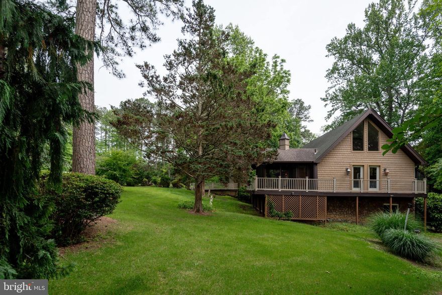 Large family, lots of visitors, homeschool, church, house hacking with roommates?  No matter what your goals are or if you're just looking for some room to spread out this unique home offers something to accommodate everyone.  The main level of this home has beautiful vaulted ceilings spanning the living room, dining room, and kitchen with big windows  for lots of light.  There is even a loft space in the living area that is perfect to display all your plants! The kitchen integrates perfectly with white cabinets and a large wood freestanding island.  A few steps down you'll find room for everyone with 6 bedrooms and 2 and a half baths.  This home is perfectly set up for working from home, home school, or multi-generational living.  As a bonus, the walkout basement has a separate keyed entrance offering one bedroom, one and a half baths, as well as a private kitchen and laundry room.  Handicap accessible with deck, catwalk and apartment suite on one level. Great for entertaining with multi-level wrap around decks, screened in porch with ceiling fan, orchard and garden spaces to enjoy nature, a trampoline and swing set convey as well.  Location is perfect for daycare or church with plenty of room for parking in the large driveway.