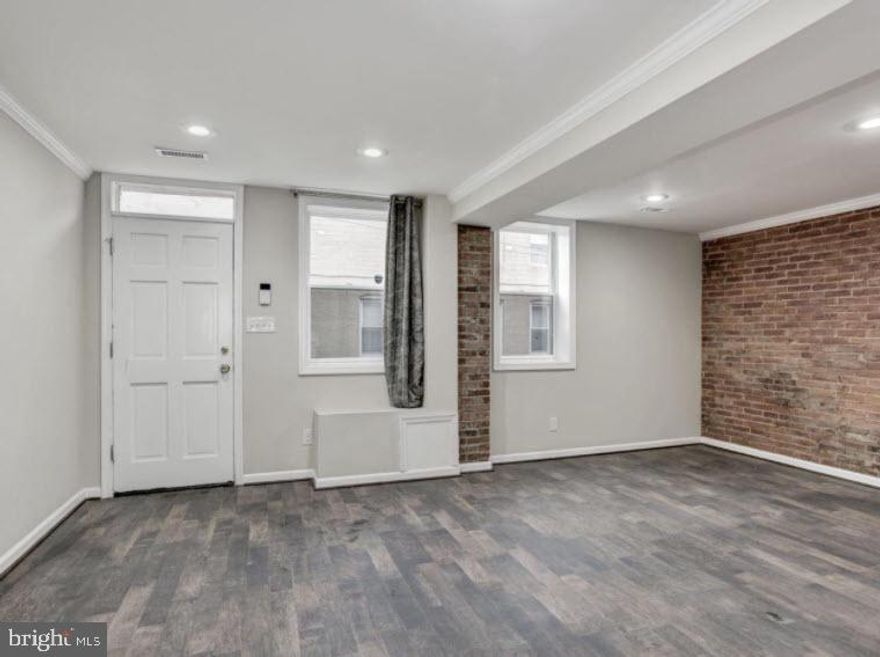 Completely Renovated End-of Group Rowhome in Upper Fells Point Embellished with Gorgeous Floors, Light Filled Interiors, and a Private Parking Pad!   Exposed Brick Walls and Recessed Lighting; Kitchen with Stainless Steel Appliances and Granite Countertops; Decorative Backsplash, and 42 Inch Soft Close Cabinetry; Main Level Powder Room, Laundry, and Access to Patio, and Parking Pad; Master Bedroom, with En-suite Full Bath, and Two Walk-in Closets; Two Bedrooms and a Full Bath Complete the Top Floor; Recent Updates: Roof, Plumbing, Electrical, Appliances, Windows, Lighting, Cabinetry, Countertops, Bathrooms, Flooring, Paint, Carpet, and More! Exterior Features: City Views, Sidewalks, Street Lights. Community Amenities: Explore all that Baltimore has to offer with the National Aquarium, Camden Yards, and M&T Stadium. A vast variety of entertainment, shopping, and dining options await you at Baltimore's Inner Harbor, The Gallery, Woodberry Kitchen, and Baltimore's Center Stage. With close proximity to Thames Street Park, Patterson Park, and Anchorage Promenade Park, your outdoor recreation activities are endless! Major commuter routes include I-95, I-83, and I-695.