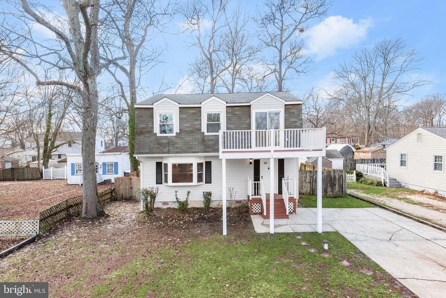 New Improved Price**This newly renovated colonial is just steps from the Chesapeake Bay! With just a block away from water views, this home will not disappoint. The seller had many upgrades completed including a brand new kitchen with granite countertop and stainless steel appliances and new flooring throughout. Freshly painted walls, newly renovated bathrooms and tons of natural light are all throughout the house. Main level half bath is ideal for when guest/family arrive. All bedrooms are nicely sized and the master bathroom features a large closet space. The backyard boasts a newly painted wood deck perfect for entertaining, overlooking an open lot. Other highlights include a front second level porch from bedroom, ample driveway, and fully fenced yard. This home is move-in ready and is ideal for any homeowner. Imagine being within minutes to water access, community fishing pier and beach, tot lot, baseball and basketball court, popular local restaurants with water views and easy access to major routes to Washington D.C., Baltimore and Annapolis. Take time to explore this lovely home and imagine the lifestyle available to the new owner! Hurry must see, won't last!! Be sure to check out the community dock and playground nearby. No HOA fees - Franklin Manor Boat Club a volunteer based community organization.