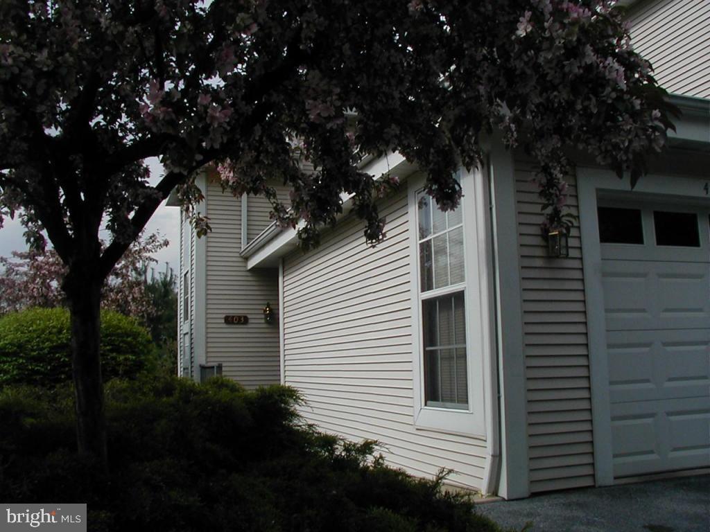 Welcome home to your low-maintenance, convenient and spacious 2 bedroom, 2 bathroom condominium tucked within the highly desirable Country Place Community in East Hempfield Township! This lower level unit condo features a large and open living/dining room combo with a charming wood-burning fireplace. The living room and kitchen both open to cozy sunroom which will have you feeling as though you’re nestled among the trees. Off the hall past the kitchen is a conveniently located pantry and laundry area which leads to the primary bedroom, complete with a large window, ceiling fan, walk-in closet and full bath. The second generously sized bedroom and fully renovated bathroom are located off the living room.
As a resident of Country Place, you’ll have access to fantastic community amenities including a private clubhouse, pool, tennis courts and beautifully maintained grounds. Plus, exterior maintenance, snow removal, trash, water and lawn care are all included, making for low-maintenance living! Conveniently located in Hempfield School District just minutes from Route 30 & Route 283, shopping centers and Penn Medicine's Health Campus. Don’t miss the opportunity to call this low-maintenance/well-maintained condo your new home!