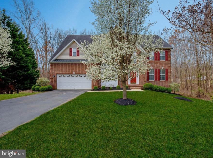 This beautiful brick front colonial home is perfect for entertaining & family living. Located on a quiet cul-de-sac, this home offers over 5,000 sq.ft. of living space and features a two story foyer, main level office, front & back stairs, gourmet kitchen, two story family room  with fireplace, huge finished basement with bedroom and full bathroom, rec. room, media room, storage & more! Relax on the large deck and back yard that backs to trees and nature. This home has all the bells & whistles, equipped with an alarm system, central vacuum and an in ground sprinkler system! Home Warranty included. Located minutes from shopping and schools, this home also provides the shortest commute from Charles County to DC, VA & military bases.