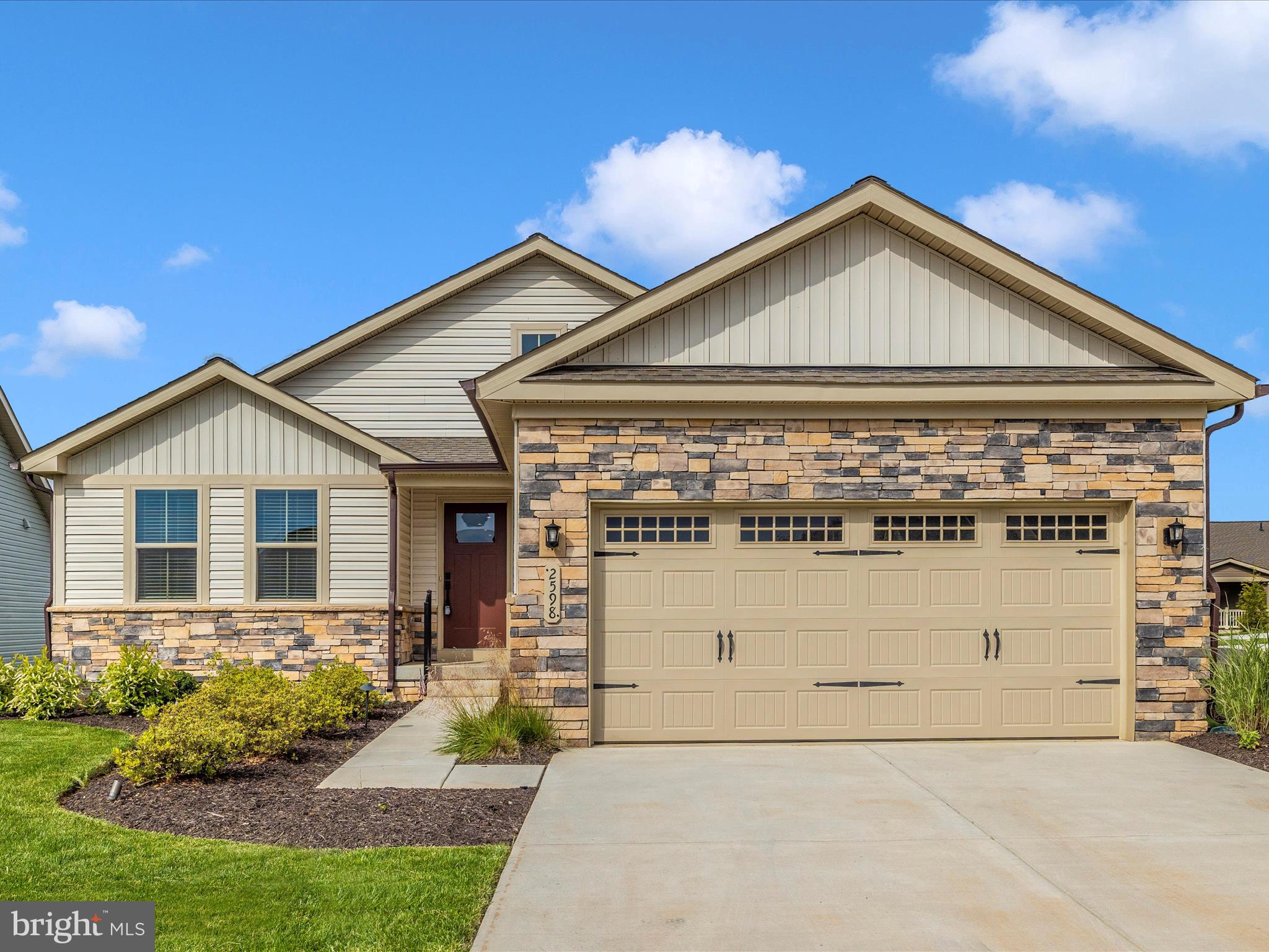 Welcome to Bloomfields Frederick's premier 55 and over community! This move-in ready home offers 3 bedrooms and two full baths all on the main level. Luxury vinyl plank throughout the living space provides a beautiful look, durability, and effortless maintenance. The kitchen's modern appearance and stylings make the perfect place to enjoy preparing your meals while the island bar adds space for seating. From the kitchen, the sliding glass door welcomes you to the gem of this house. The covered rear deck showcases the stunning views of the mountains, green space, and a tranquil pond. Live with the peace of mind of a home built in 2023 with *like new* HVAC, tankless hot water heater, roof, and appliances. Bloomfields offers "lock and go", stress free living with tasks like lawn care and maintenance and snow removal included giving you more time to enjoy the many available and upcoming amenities and activities. Located just minutes to Downtown Frederick, shopping, hospital, and major commuter routes. Ryan Homes is currently SOLD OUT in Bloomfields. Don't wait on them! Get in TODAY! Set up your showing FAST!