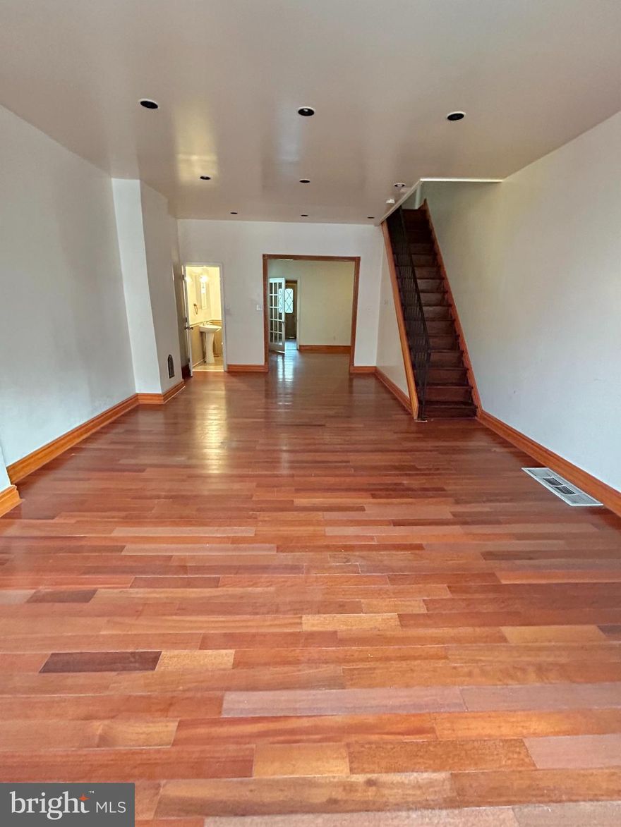 Spacious 3 bedroom, 2.5 bathroom home located in the Whitman section of South Philadelphia.  At over 1,400 square feet, this home is unusually large for South Philly!  Enter into an enormous living room with hardwood floors, recessed lighting, and beautiful, natural wood trim details.  A first floor powder room is conveniently located right off this living area.  The living room flows into the dining room, which leads to a generously sized kitchen with a gorgeous recessed ceiling, gas range stove and hood, and plenty of counter and cabinet space.  The kitchen leads to a quaint rear backyard, perfect for light gardening, grilling, or outdoor entertaining.  The upstairs has 3 good sized bedrooms, and the rear bedroom has its own private full bath with walk-in shower.  Off the 2nd floor common hallway, there is an additional full bath, which includes a tub and shower.  The front bedroom is large and can easily fit a king sized bed with room to spare.  All of the bedrooms have closets, and the 2nd floor hallway also has a linen closet.  The basement includes a washer/dryer and is great for additional storage.  Conveniently located near I-95 and major highways, as well as shopping centers on Snyder Ave and at Whitman Plaza.  Also within walking distance to Mifflin Park and Bok Bar, a local favorite with incredible views of the city.   Schedule your showing today!