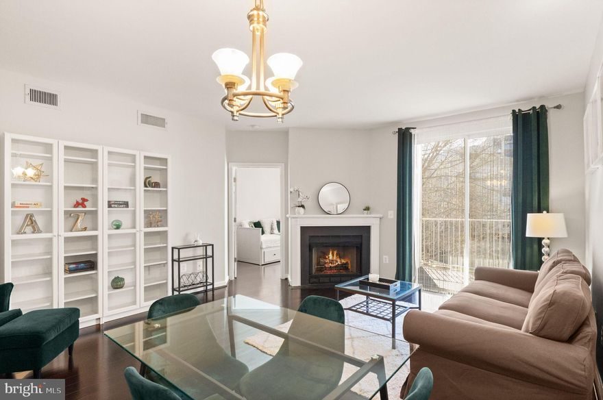 Style, Convenience, Location—All in One. Beautifully updated and move-in ready 2-bedroom, 1-bath condo in Lillian Court, perfectly located in the heart of Tysons’ Central Business District—just steps from Tysons Galleria, premier dining, and minutes to Metro and major commuter routes including I-495 and Route 267. 

This light-filled home features a thoughtfully designed open floor plan with sleek dark flooring and a welcoming living area anchored by a cozy gas fireplace and elegant lighting. The space flows seamlessly to a private balcony/patio—perfect for relaxing or entertaining.  The kitchen is both stylish and functional, offering granite countertops, stainless steel appliances, a gas range, a built-in microwave, and ample cabinetry. The spacious primary bedroom includes a large walk-in closet, while the versatile second bedroom is ideal for guests or a home office, complete with a closet and natural light. 

The updated bathroom showcases Italian marble tile, and a full-size washer and dryer add everyday convenience. Residents of Lillian Court enjoy a secure, amenity-rich lifestyle with a pool, fitness center, clubhouse, and beautifully maintained grounds. Assigned parking (#5) and ample guest parking make daily living effortless.  Enjoy unbeatable access to the Silver Line Metro, The Boro, Whole Foods, Wegmans, and endless shopping, dining, and entertainment options.  Move right in and experience the best of Tysons living—where comfort, convenience, and lifestyle come together seamlessly.

Condo updates:
New dishwasher - 2022
Bathroom mirrored medicine cabinet - 2022
New garbage disposal - 2026
New kitchen faucet - 2026
New outlets and light switch cover plates throughout - 2026
Freshly painted throughout - 2026

Building/community updates:
New elevators - 2025
Refreshed business center, game room, etc - 2026