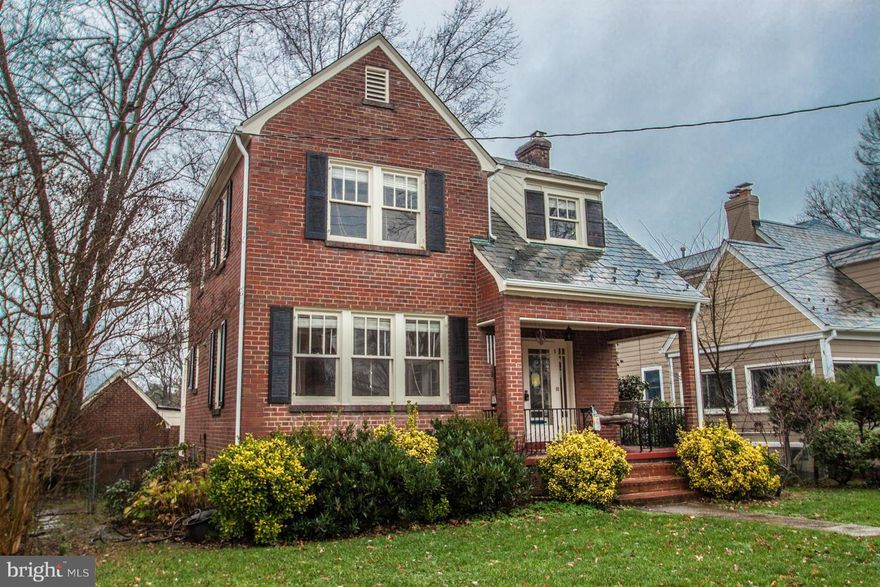 Great charm, expanded colonial with front porch, detached garage, carport & alley access. Professional painted throughout and all hardwood floors just refinished.  Rear 2-story addition provides for a family rm, larger kitchen & master bedroom expansion.  Cozy LR fireplace, finished lower level, main floor powder rm.  Only a few blocks to the King Street Metro. Fenced backyard.