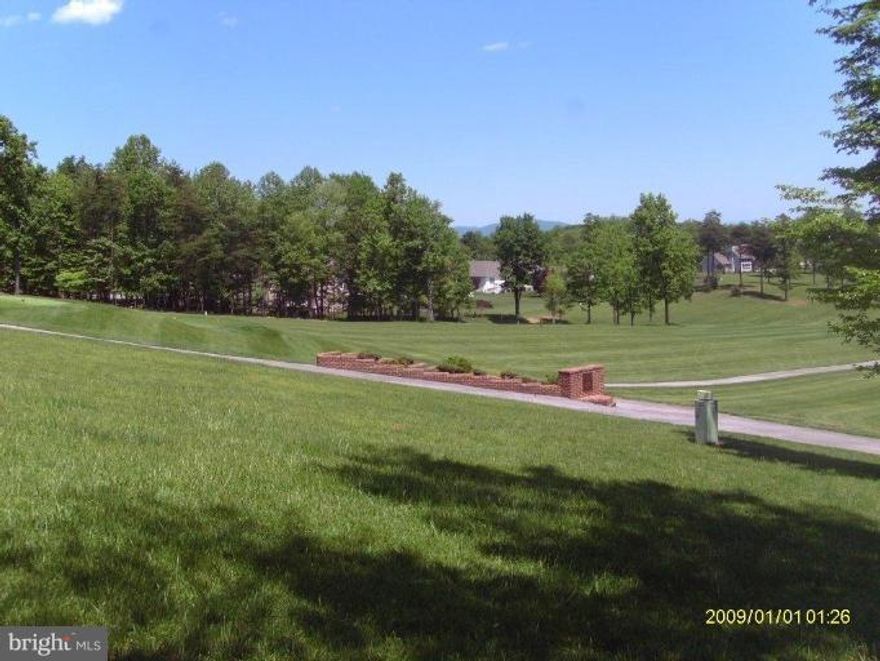 This beautiful golf course homesite is 1. 14 wooded acres. It has sweeping views of the 16th Fairway of the Mountain View Championship Golf Course! Suitable for a side walk out basement. Don't miss this rare opportunity to own this unique golf course frontage lot with gorgeous mountain views! Perfect location to build your primary, retirement or vacation home. Class A (Indoor/Outdoor/Golf) membership available.