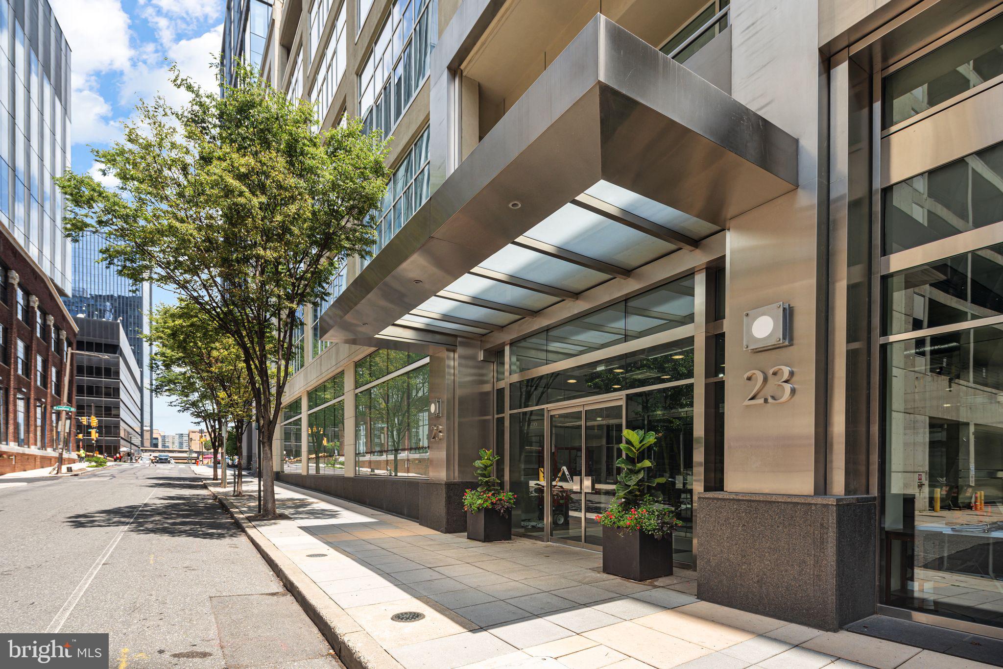 Perfectly located between Rittenhouse Square, Fitler Square, Center City, and University City, Unit 2L at 23 Condominiums offers a bright, spacious layout ideal for a medical resident, first-time buyer, student, or pied-à-terre retreat. This sun-drenched second-floor condo features soaring 11' ceilings, gleaming hardwood floors, recessed lighting, and an exceptionally large private balcony—rare for the building. The open-concept kitchen is designed for both style and function, featuring granite countertops, spacious center island and Viking stainless steel appliances. The generously sized bedroom is flooded with natural light and includes an en-suite bathroom featuring a double vanity along with a shower and bathtub.
Originally built as a garage in the early 1900s, 23 Condominiums was thoughtfully transformed in 2005 into an architecturally striking mid-rise clad in Italian limestone and sleek glass. Residents enjoy full-service amenities including 24/7 concierge, glass-enclosed elevators with atrium views, a rooftop deck with sweeping city vistas, a tranquil community garden, and optional garage parking. Currently, the building is undergoing lobby and hallway renovations to enhance the living experience. The special assessment is negotiable with an acceptable offer.
Situated in the prestigious Greenfield School District and just steps from UPenn, CHOP, Drexel, 30th Street Station, Trader Joe’s, the Schuylkill River Trail, and the exclusive Fitler Club, this home offers unparalleled access to Philadelphia’s best dining, culture, and outdoor spaces.