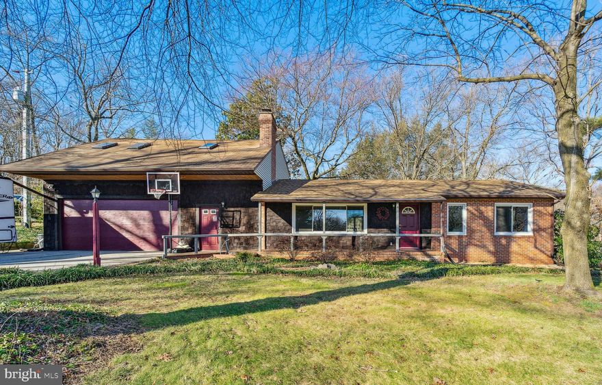 Welcome home to this custom rancher on a large and private lot. You will find many updates and improvements were completed over the years. Extensive landscaping with a variety of perennials are eagerly waiting for the warm spring sun to burst into color.  Several Japanese Maple trees in the front yard will delight you, while raised garden beds in the back yard are ready for planting. The shed is equipped for getting seedlings ready for planting season. A shaded playground will provide hours of fun for family or guests. The expansive deck has built-in seating and a gazebo that conveys. The outdoors can be enjoyed year-round with the large four-season family room that is part of a large addition on the back of the house.  Everyone will love to gather here, in the heart of the home, with open flow to the kitchen and living room. The bright gourmet kitchen with skylight, features a bar top, 42" cabinets, expansive granite countertops, stainless  steel appliances, a propane gas 5-burner stove, second oven, wine fridge, two sinks, and an island. With plenty of space that spans the family room and eat-in kitchen, you can effortlessly switch from your daily meals to entertaining large gatherings during your favorite holidays and special occasions. At the back of the kitchen, the door allows access to the mud room with laundry hookup and a bonus, large walk-in pantry. The large living room a the front of the home is so inviting with the large window spanning the length of the room, and oversize fireplace with stone-front.  Retire here after a long day to sip a cup of tea by the fire in the pellet stove, or watch your favorite show. The main floor has a primary bedroom suite, complete with en-suite bathroom and walk in closet. A large bay window overlooking the back yard extends the room in the arms of nature where you will blissfully fall asleep. A second large bedroom across the hall has access to the just remodeled hallway bathroom, with brand new tub and shower, ceramic tile surround, undermount vanity sink. The finished portion of the lower level features a large recreation area that can be used as an office, hobby space, gym, guest quarters, kids play area, and a full bathroom. An oversize room in the unfinished area features work stations with benches, and shelving for storage. The utility room offers additional storage. Possibly the best part of the home is the finished upper level over the large 2-car garage. This could be a totally separate area for in-laws, au pair, out of town guests, or an income producing guest suite. There are two entrances to this part of the home: through the living room or through its own separate exterior entrance. Two bedrooms, a full bathroom with tub and shower, a living room with kitchenette complete the space. Conveniently located, the home is only 15 minutes from Fort Meade and BWI, and 20 minutes from Annapolis. A one year home warranty conveys.