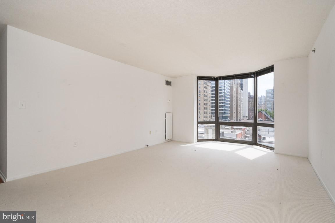 One bedroom with sunrise city views steps from Rittenhouse Square! Enter the condominium through a foyer with double coat closet. There is a spacious living and dining room with carpet and a large bay window providing great natural light and eastern city views. The updated kitchen has a stylish mini subway tile back splash, modern white cabinetry, quartz countertops, and Frigidaire stainless steel appliances. The bedroom has hardwood floors, a wall closet and a large bay window. There is easy access to a spacious hall walk-in closet. The full hall bathroom has a granite-appointed vanity, tile floors and shower/tub. The Wanamaker House is located just off Rittenhouse Square, on Walnut Street between 20th and 21st streets. Residents of The Wanamaker House enjoy the 24-hour front desk, access to the roof top swimming pool, exercise room, and on-site garage parking for an additional fee, subject to availability. Rittenhouse Square is ranked the 6th best neighborhood in North America by Place Rated Almanac. There are 175 restaurants and 199 retailers within a three block radius. It is within close walking distance to the Market Street office corridor, The Avenue of the Arts and University City. 30th Street Station and Philadelphia International Airport are only minutes away.