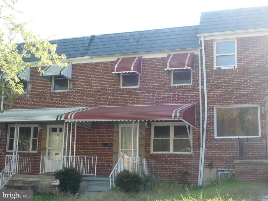 THIS BRICK ROWHOME HAS COVERED FRONT PORCH, GLEAMING WOOD FLOORS, GAS HEAT/CENT. AIR, REPLACEMENT WINDOWS, FENCED REAR YARD.  MOLD PRESENT IN THE BASEMENT  *ONE LENDER*