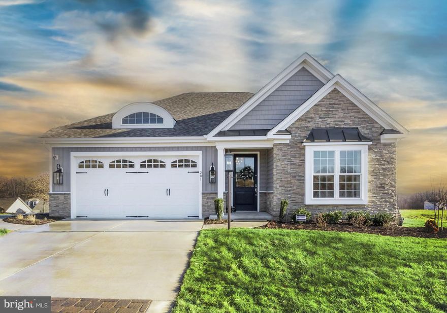 Welcome to Canterbury Park at Bulle Rock, an exciting new enclave of homes by Trademark Custom Builders, set within the prestigious, gated community of Bulle Rock in historic Havre de Grace, MD. This thoughtfully planned section will feature homesites backing to serene woods or the nationally ranked Bulle Rock Golf Course, offering privacy, views, and an elevated lifestyle. This TO-BE-BUILT ranch-style home is designed for effortless main-level living and showcases two bedrooms and two full baths, including a spacious primary suite. The gourmet kitchen anchors the home and flows seamlessly into a stunning great room, where buyers may choose from elegant luxury ceiling treatments such as a coffered ceiling, exposed beams, or a barrel ceiling—perfect for both everyday living and entertaining. A convenient main-floor laundry room and a rear covered porch add to the home’s comfort and functionality. Newly included features enhance both style and value, with upgraded exterior stone options, wood shelving in all closets, custom paint packages, and more—hallmarks of Trademark Custom Builders’ attention to detail and craftsmanship.
The lower level offers exceptional flexibility and may be finished to include a third bedroom, an additional full bath, and a spacious recreation room, ideal for guests or entertaining. Residents of Bulle Rock enjoy a truly maintenance-free lifestyle with lawn care and snow removal included, along with access to the impressive Residents’ Club, featuring a full fitness center, indoor and outdoor pools, tennis and pickleball courts, and a full calendar of community amenities. Interested buyers are encouraged to VISIT THE MODEL HOME to explore available floor plans, homesites, and customization options. Discover luxury, convenience, and timeless design—your next chapter begins at Canterbury Park at Bulle Rock.